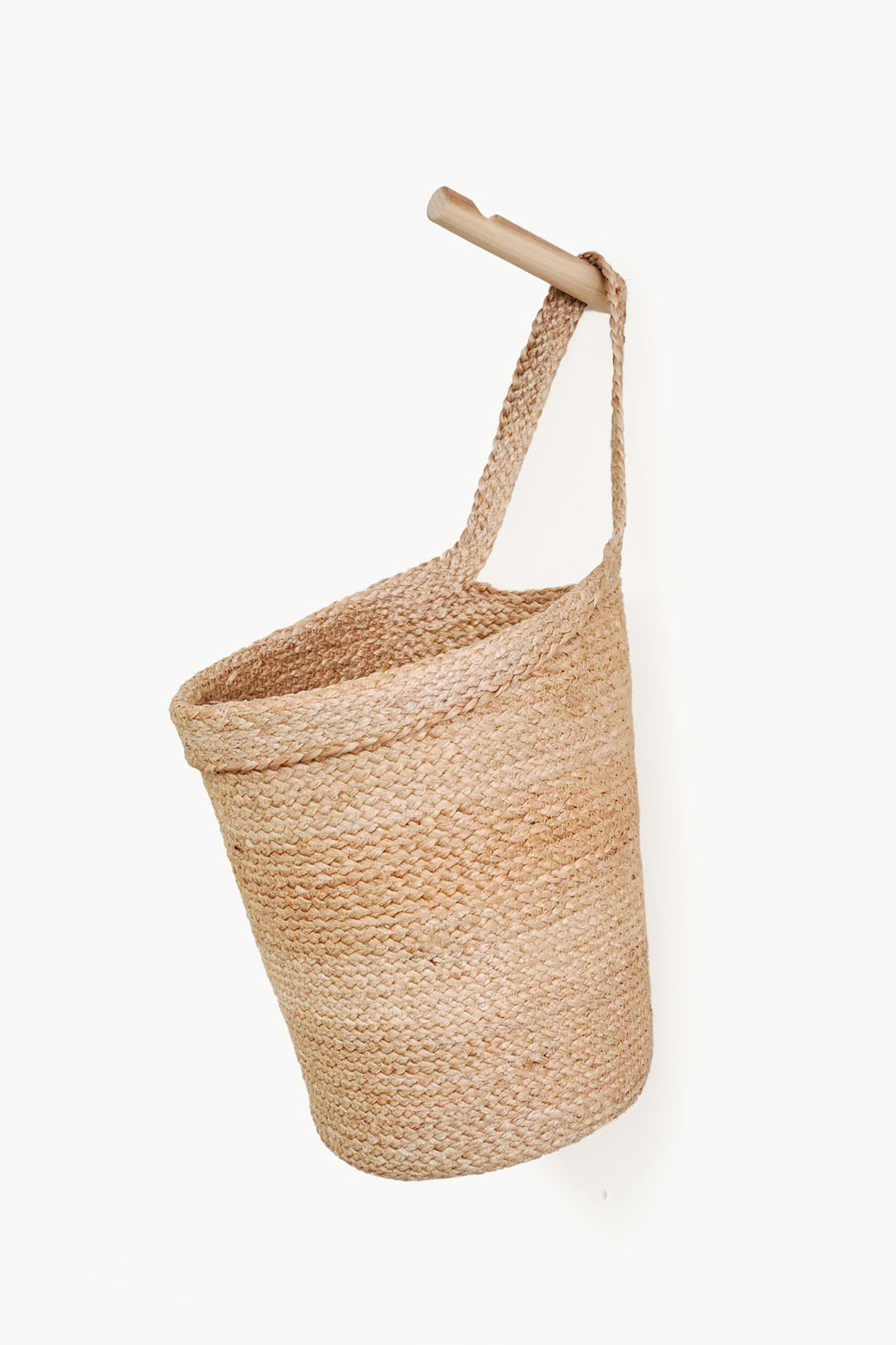 Woven basket with a handle on a white background