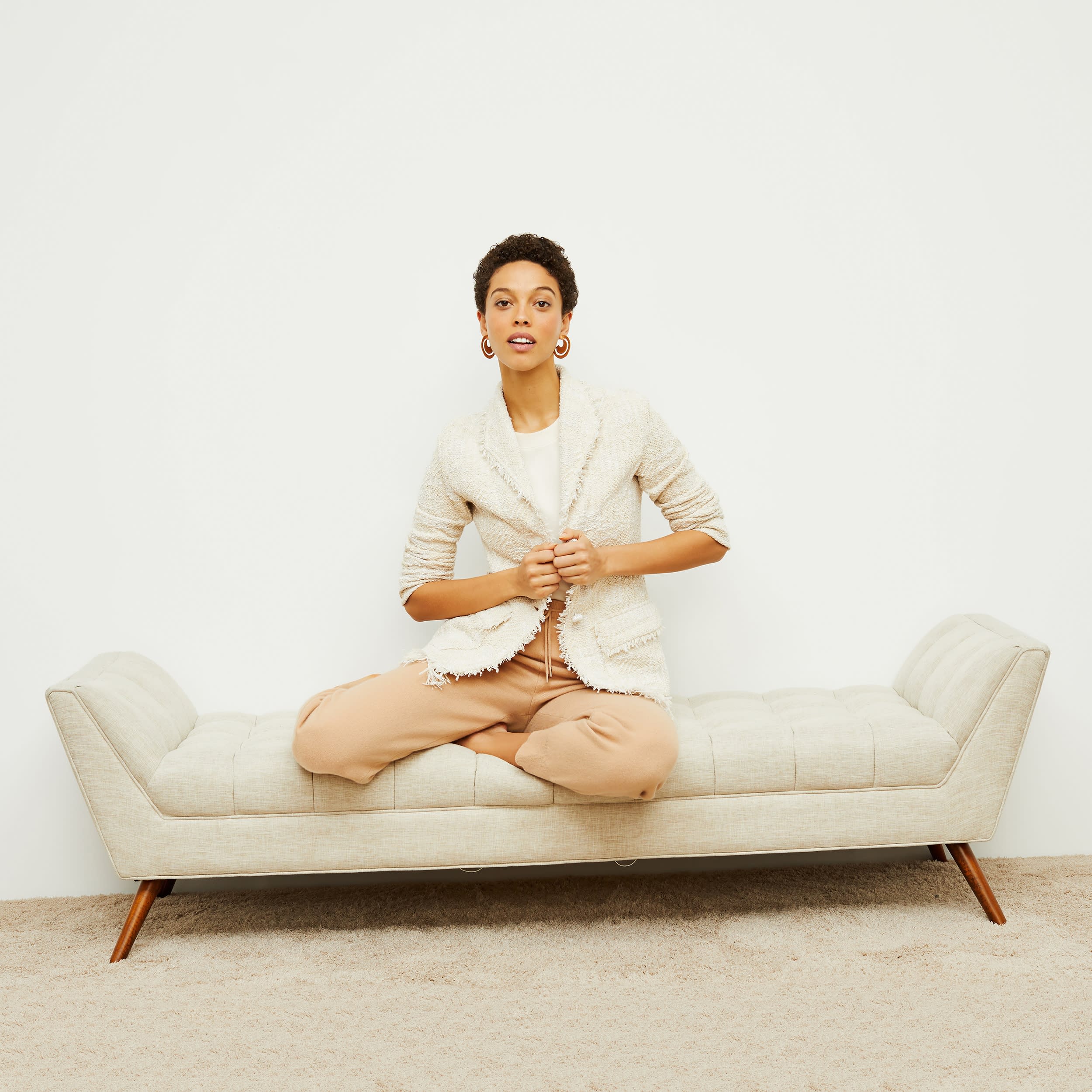 Front image of a woman standing wearing the porter jacket in taupe and ivory | Exclude