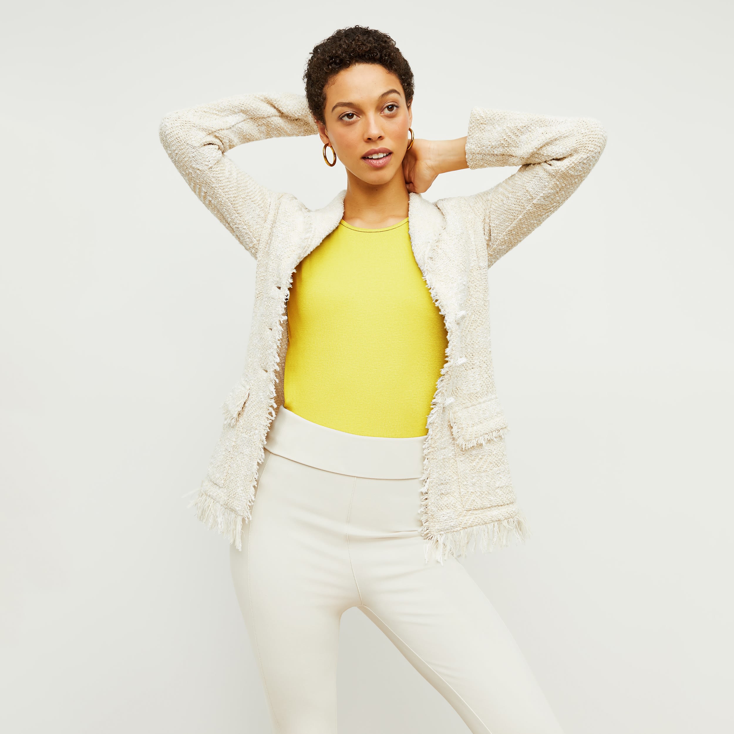 Front image of a woman standing wearing the porter jacket in taupe and ivory | Exclude