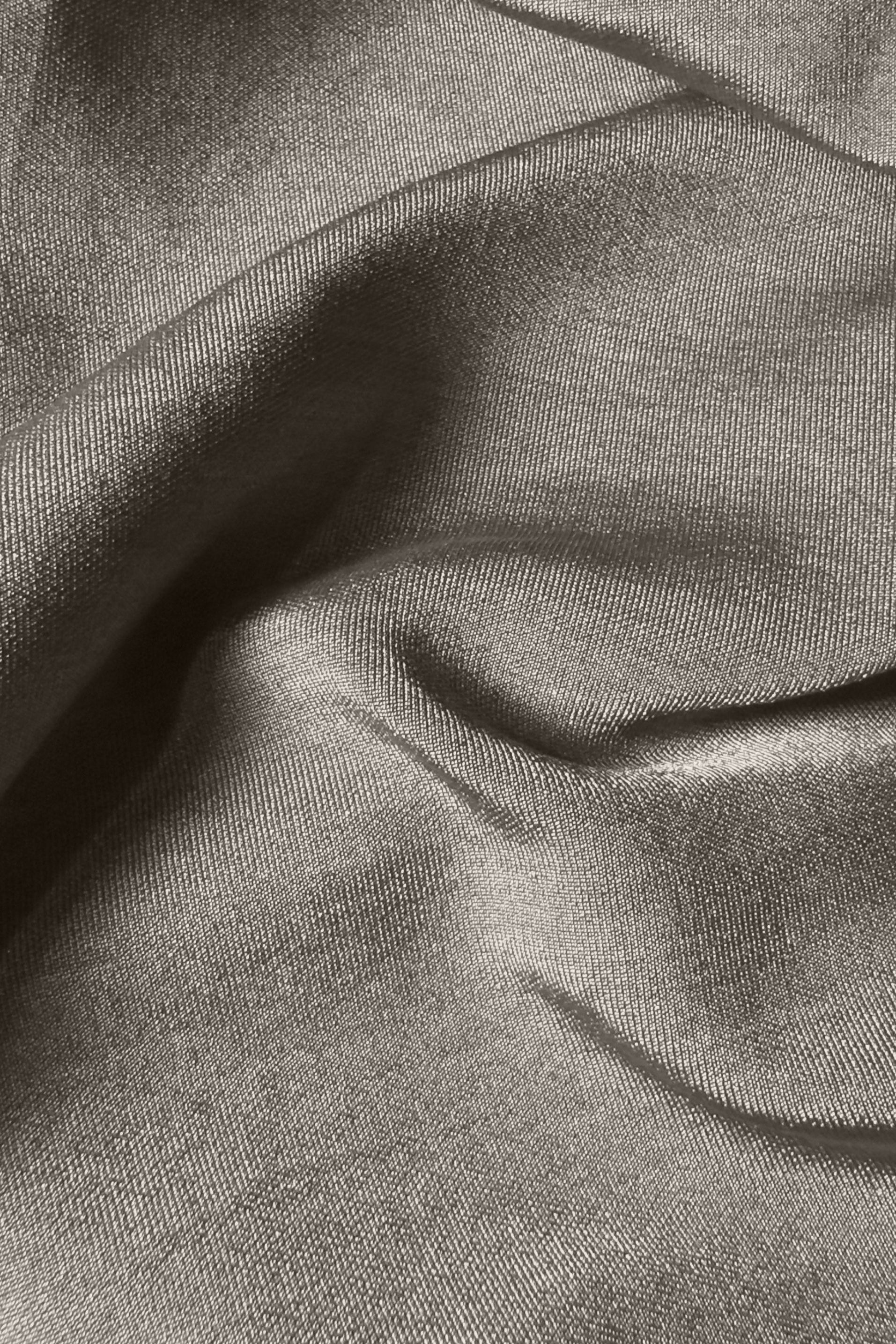 Close up of silver fabric.