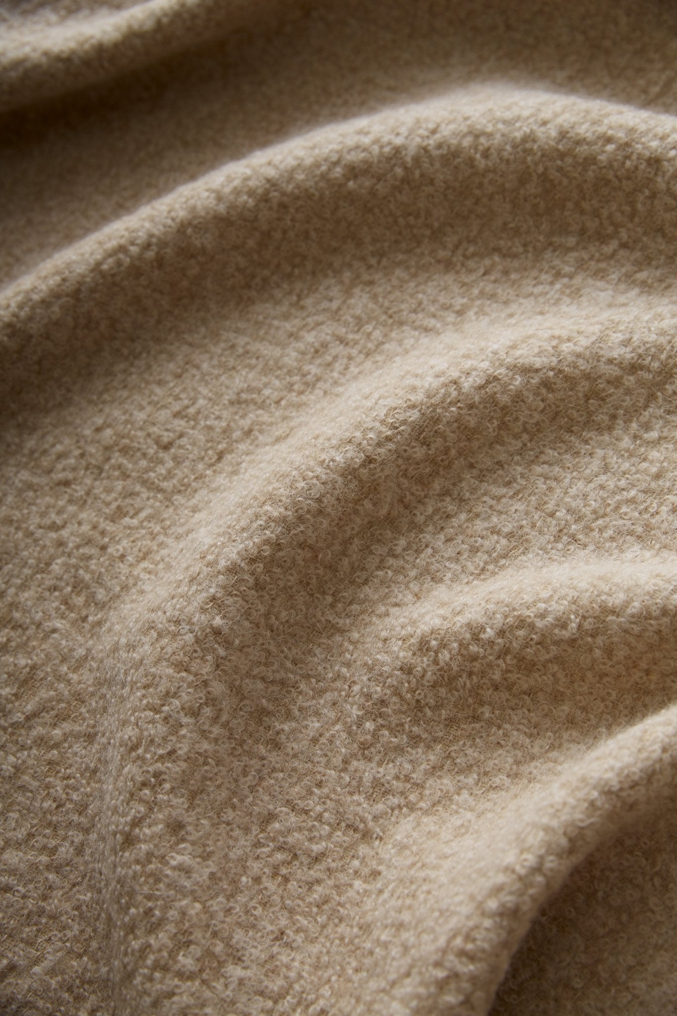 Close-up of beige fabric with visible texture