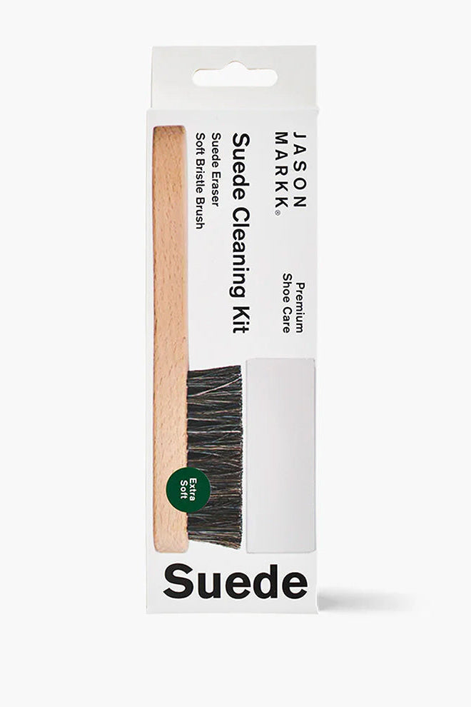 Suede cleaning kit with brush and packaging on a white background