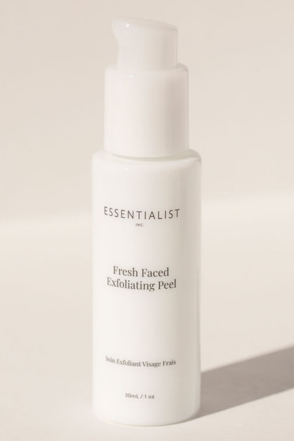 Skincare bottle labeled 'Essentialist' on a light background