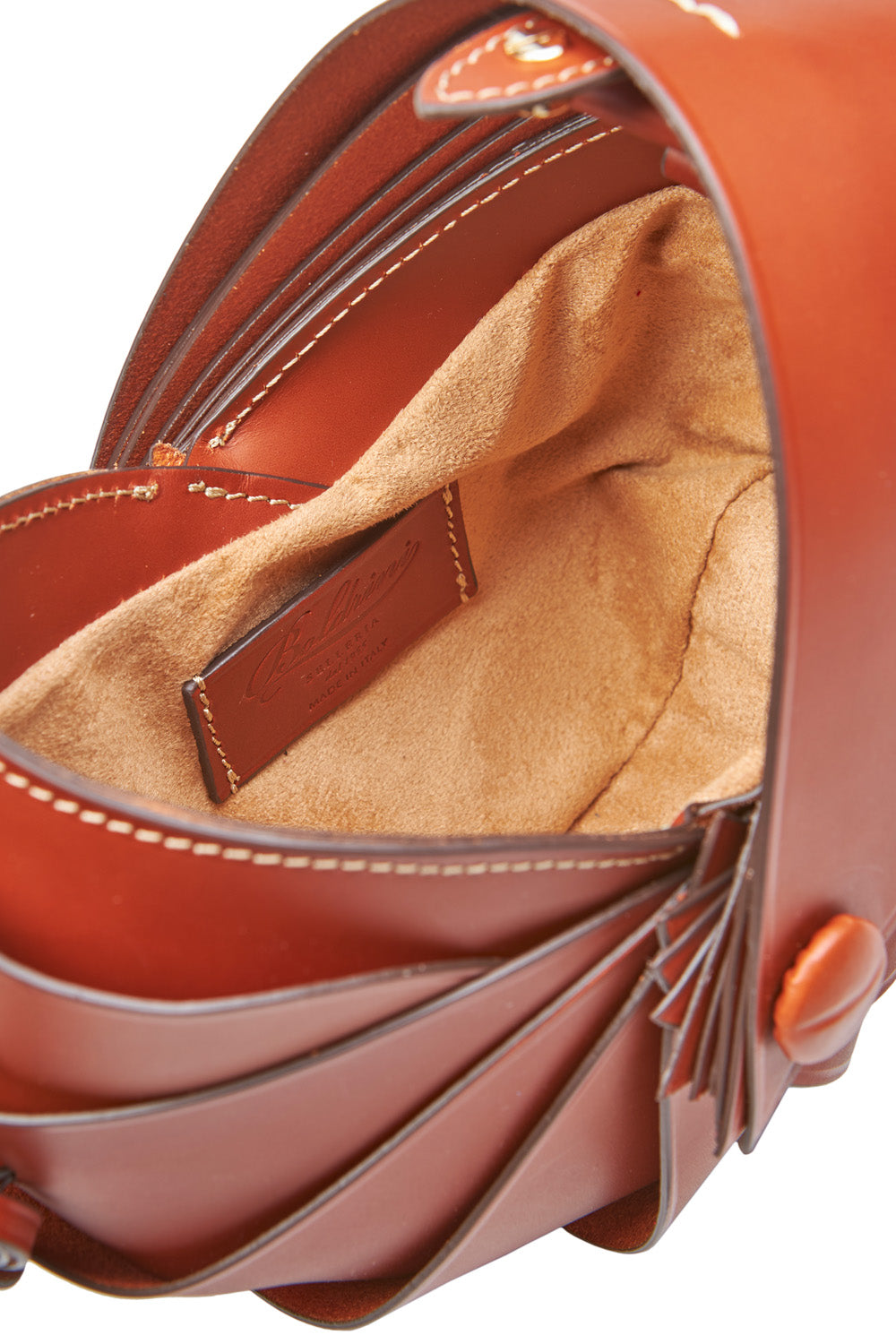 Close-up of a brown leather handbag with visible stitching
