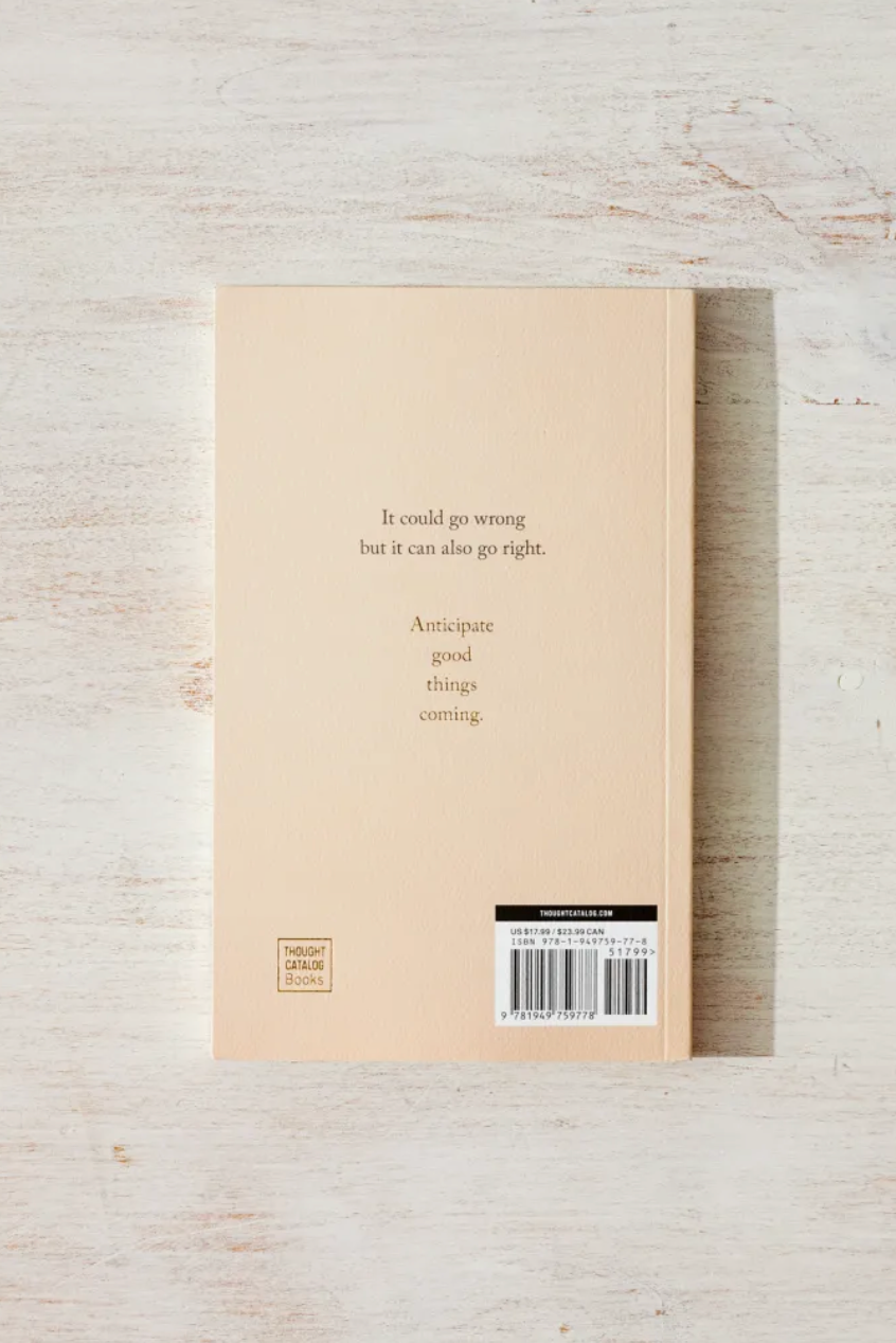 Beige cardboard box with a barcode on a light wooden surface