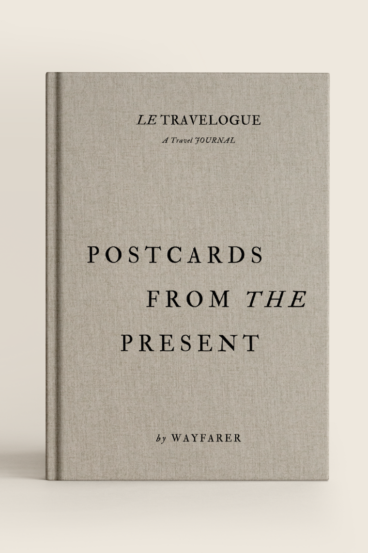 Book titled 'Postcards from the Present' by Wayfarer on a beige background