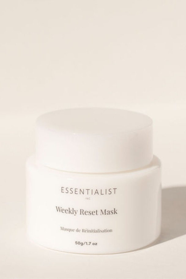 White jar of 'Essentialist' Weekly Reset Mask on a beige background