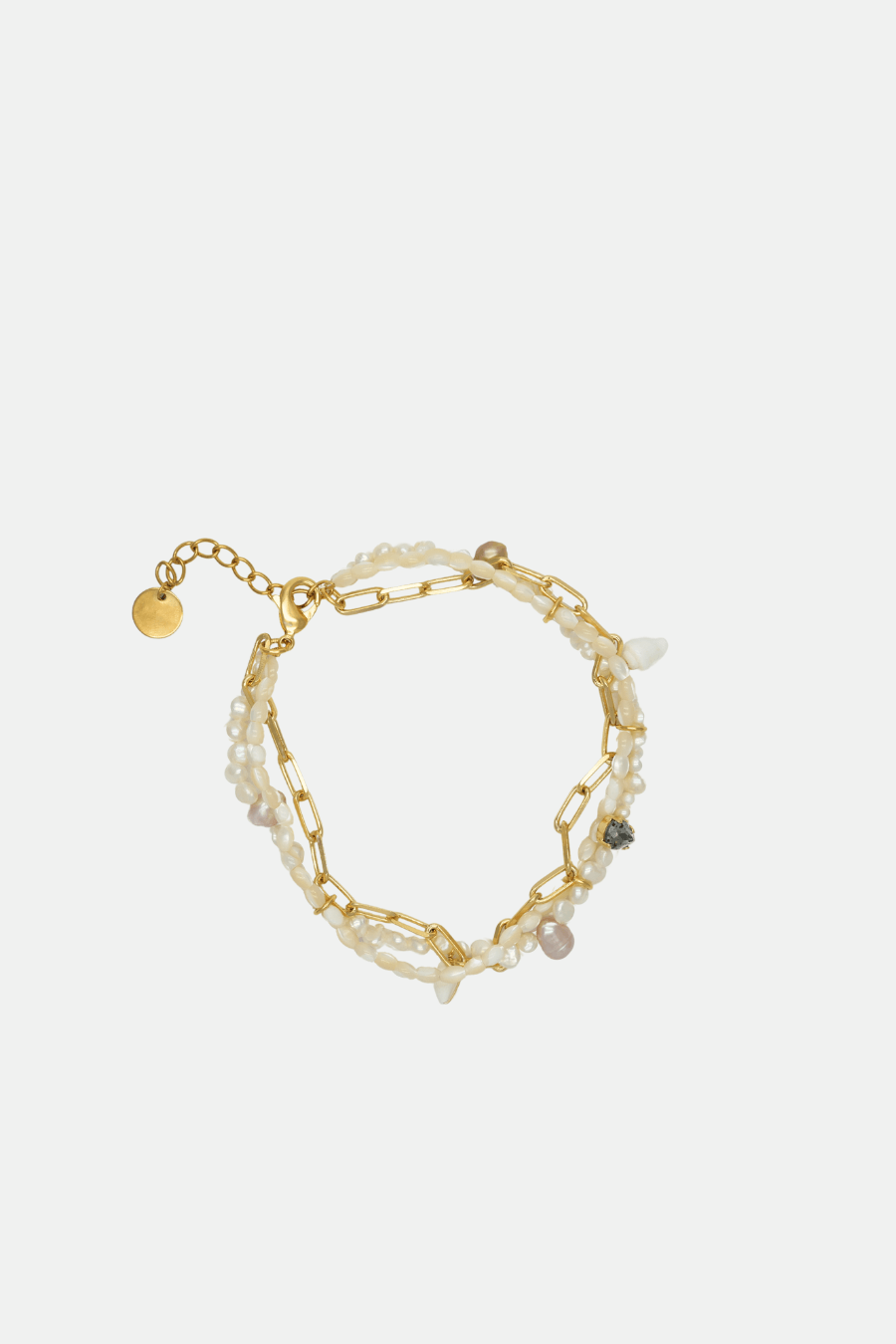 Gold chain bracelet with pearls on a white background