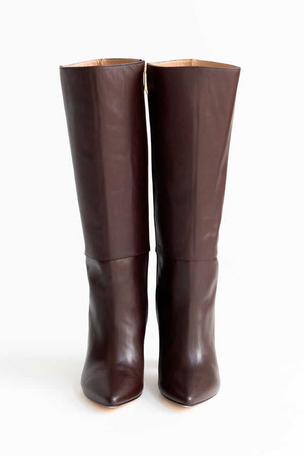 A pair of dark brown leather knee-high boots with pointed toes and a low block heel, shown from the back on a white studio background.
