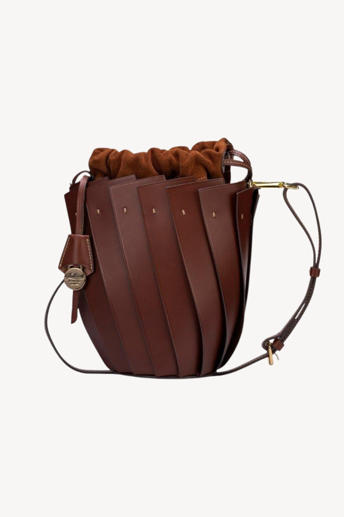 Brown leather bucket bag with a strap on a white background