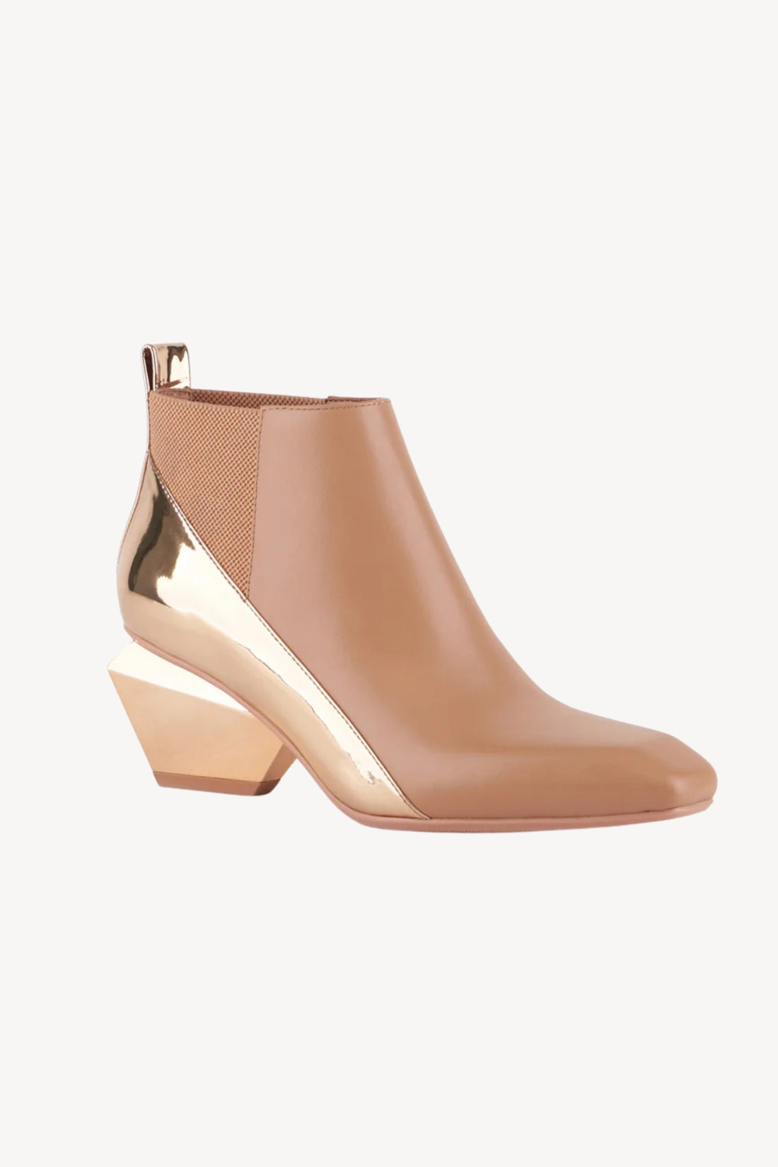 Nude-colored ankle boot with metallic heel on a white background