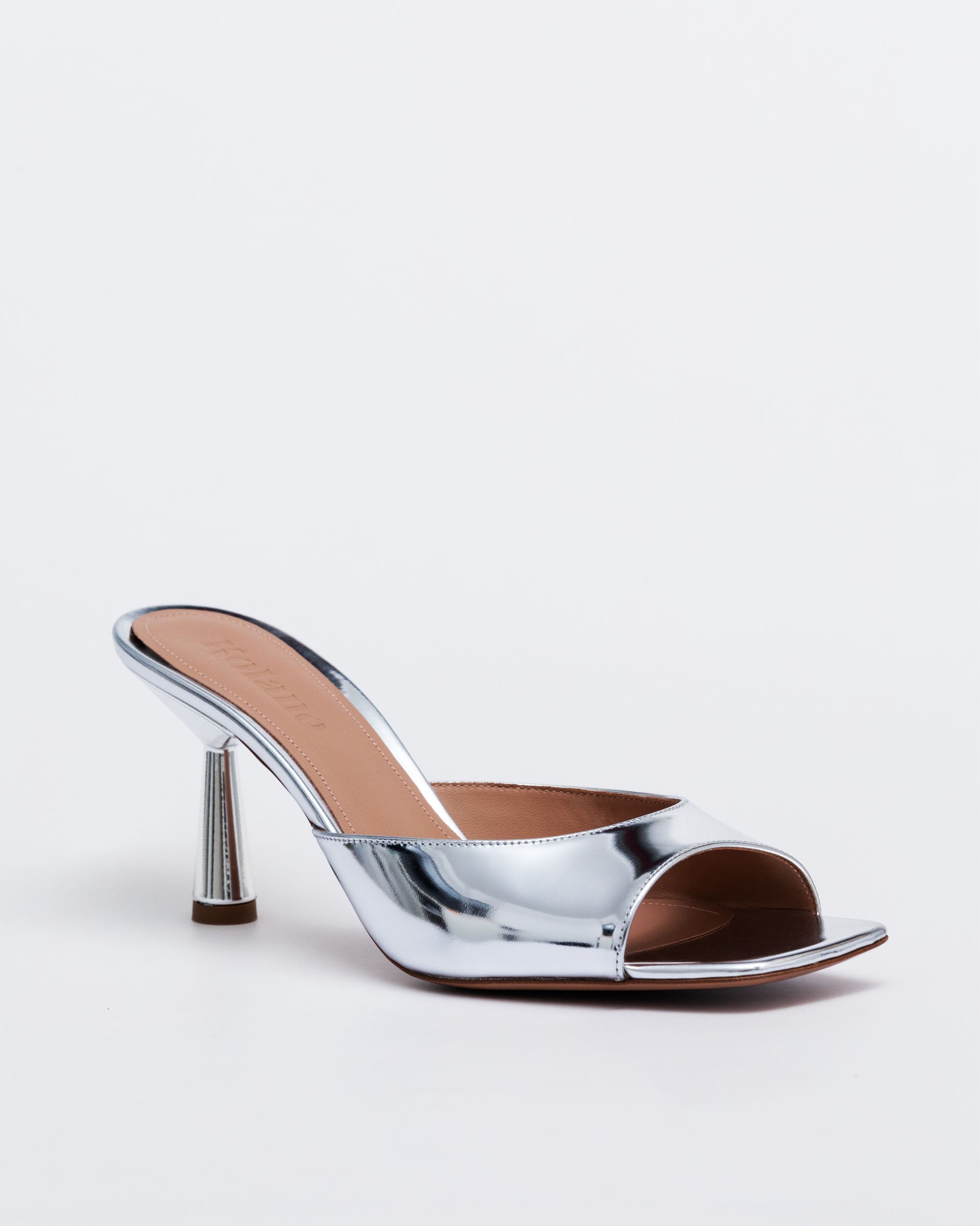 Silver high-heeled shoe on a white background