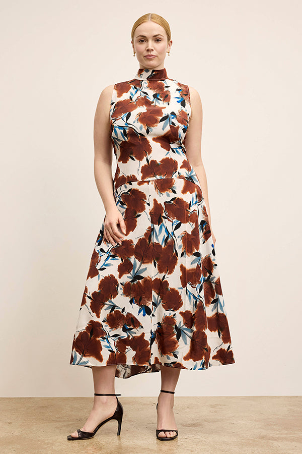 Woman wearing a floral dress with a neutral background | Exclude | Grid