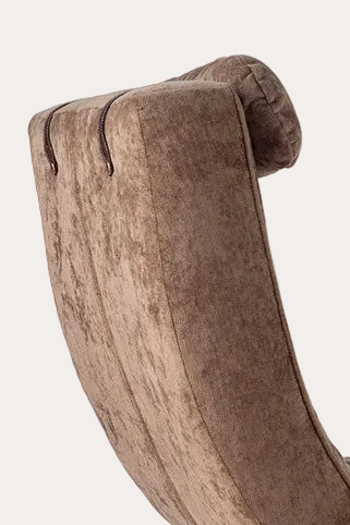 Brown upholstered chair and ottoman on a white background