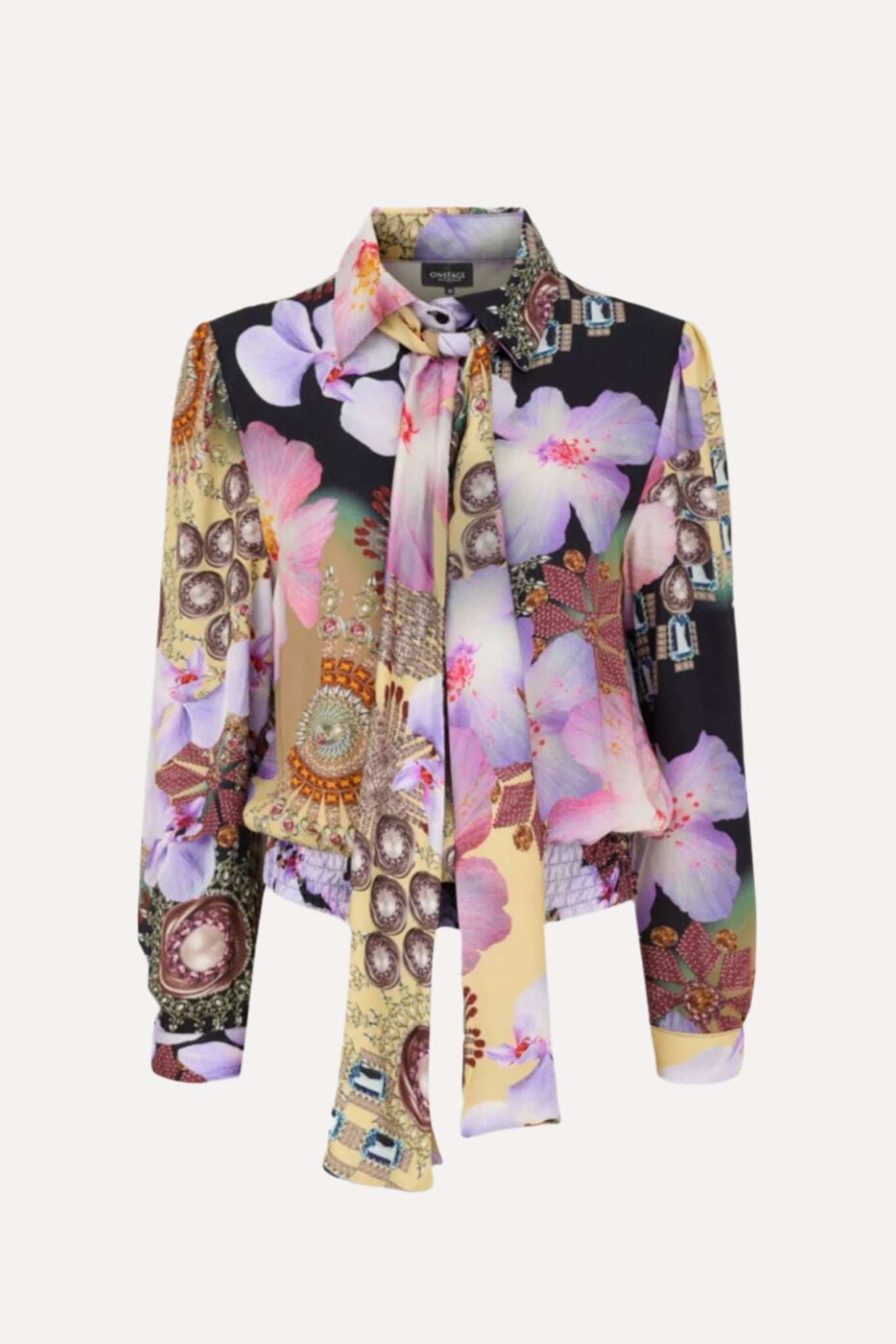 Colorful floral and abstract patterned shirt with matching scarf on a white background