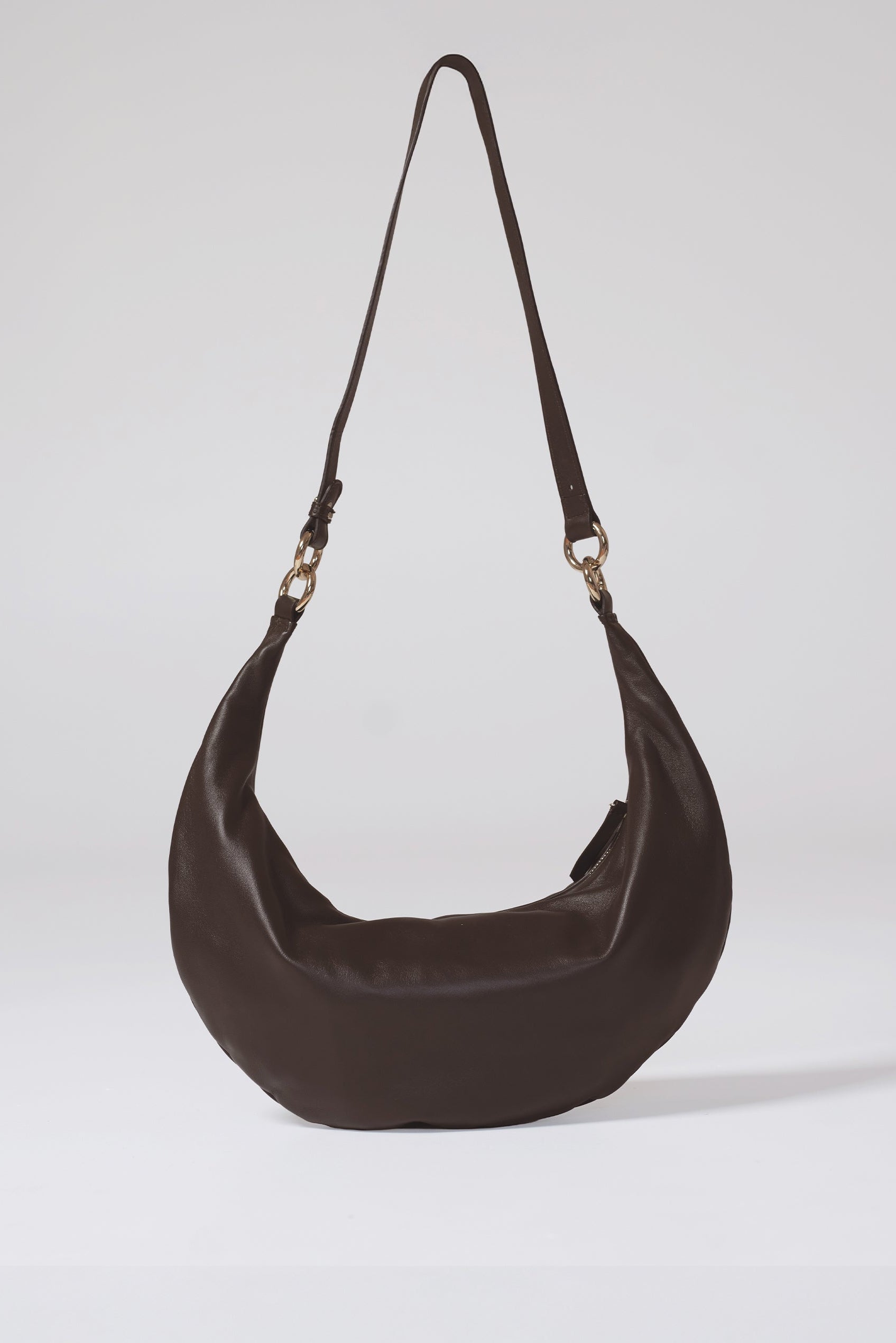 Brown shoulder bag on a light gray background