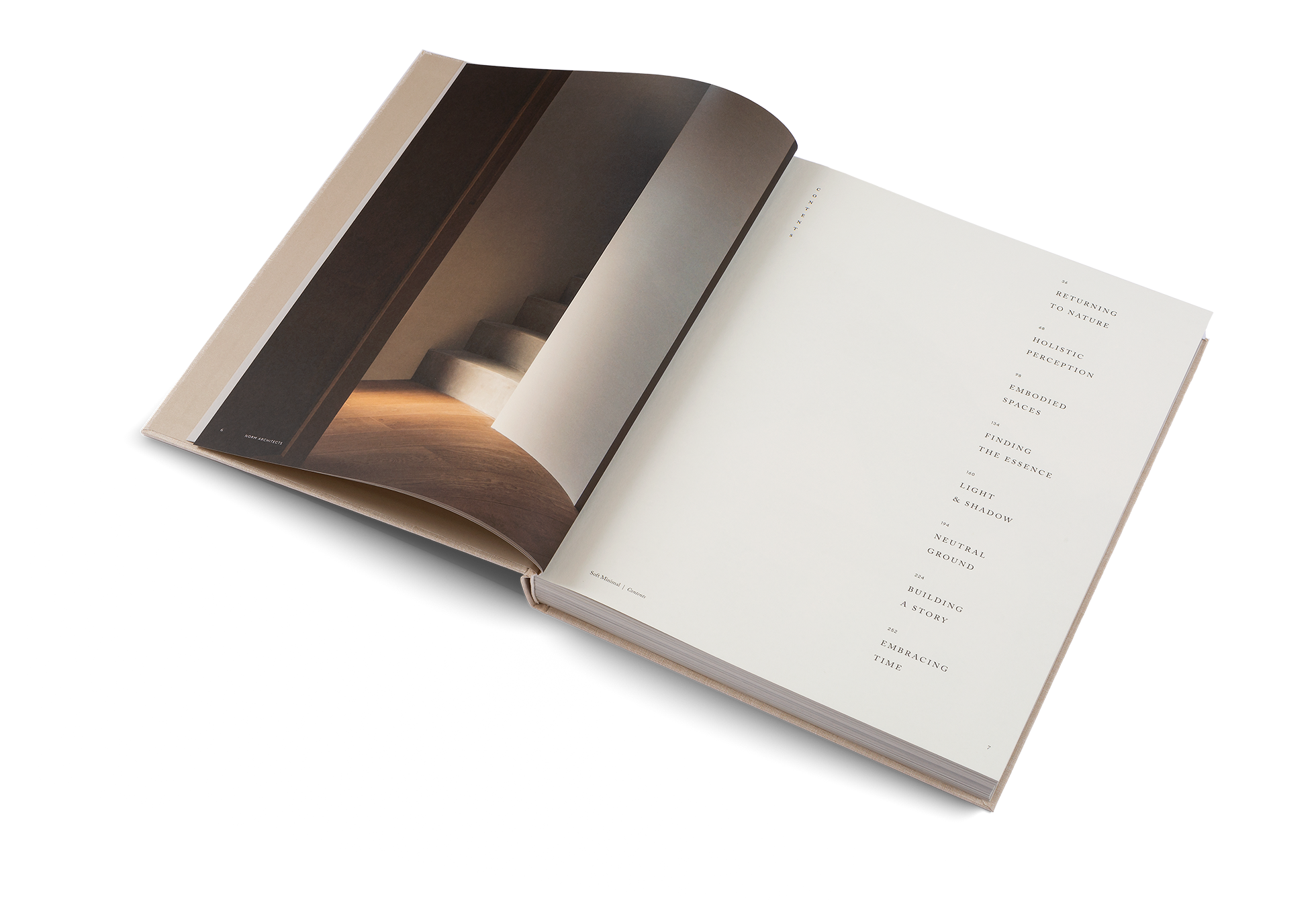 Open book with a photograph on one page and text on the other, on a white background