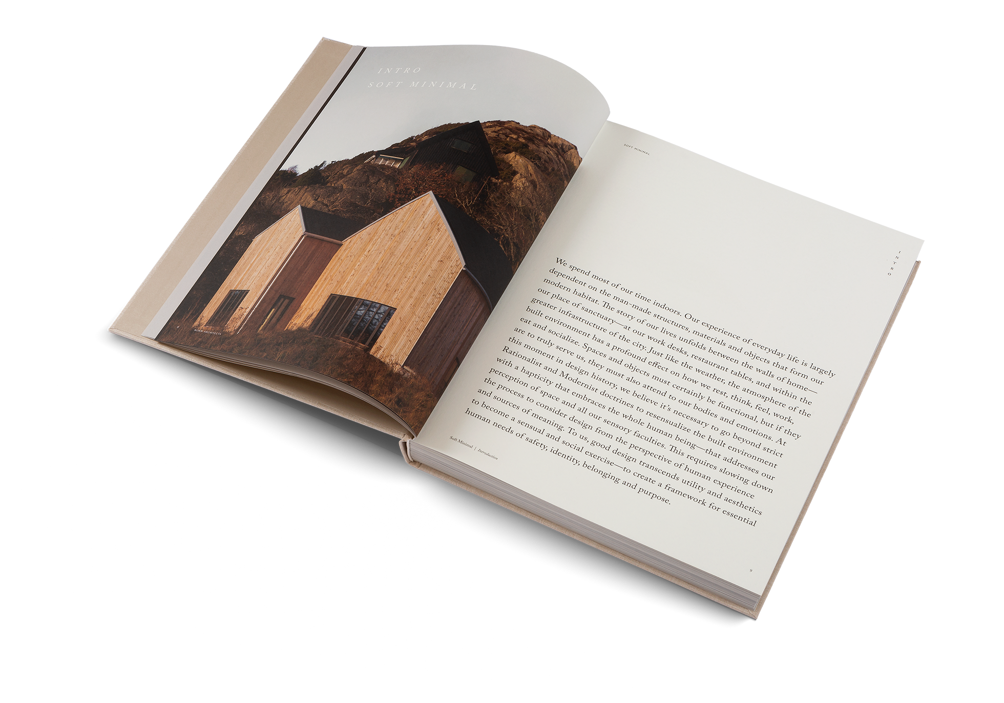 Open book with a photograph of a wooden cabin on a white background