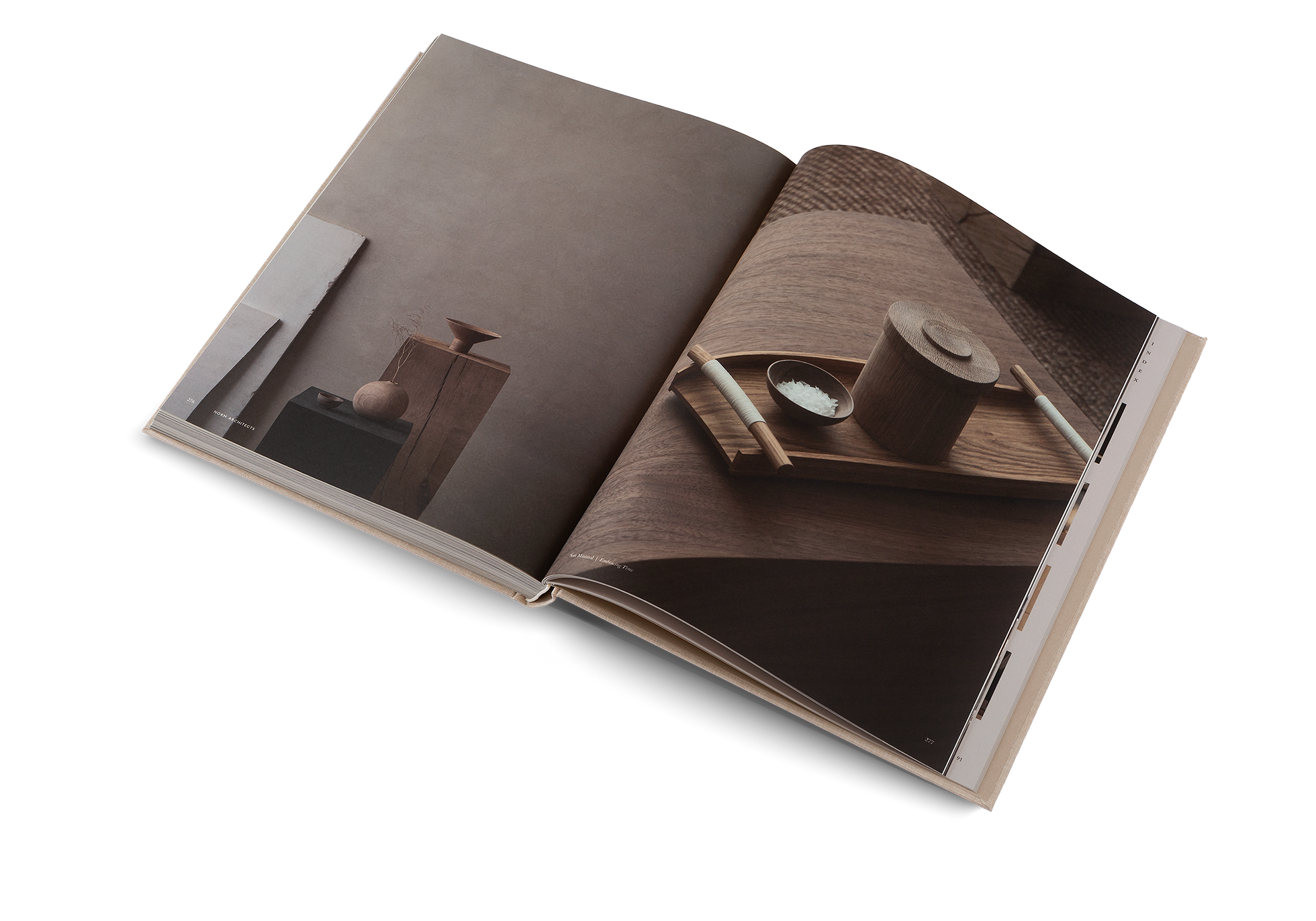 Open book showing a photograph of wooden objects on a white background