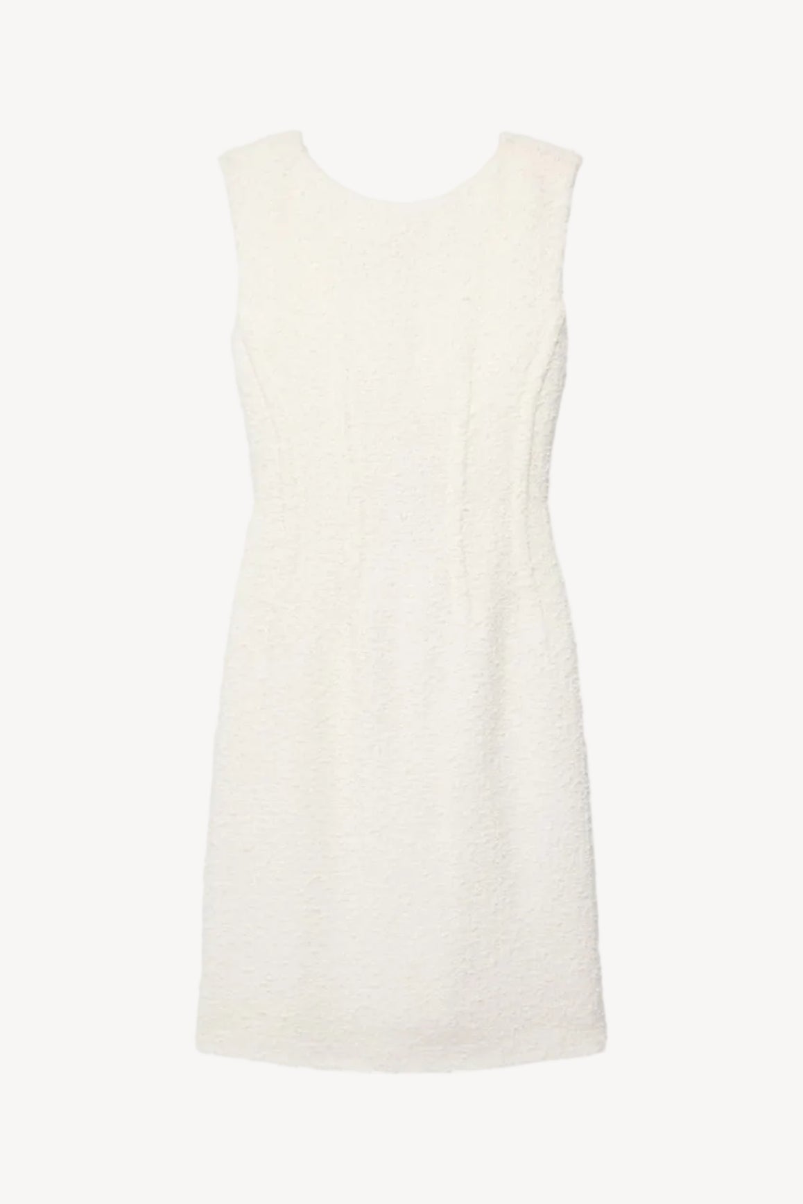 White sleeveless dress on a light beige background