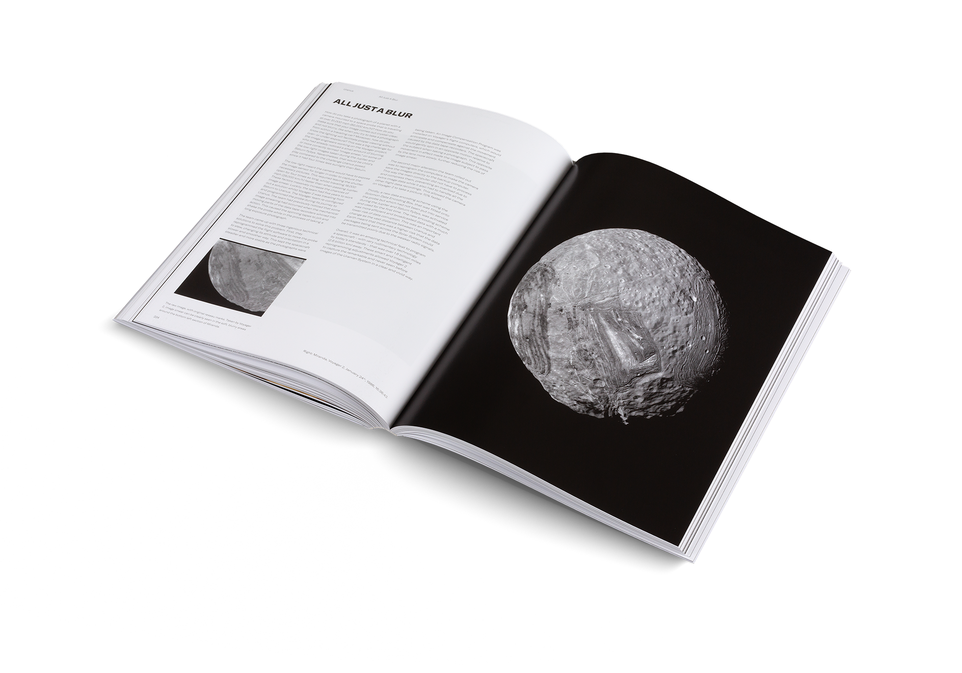 Open book showing black and white images of celestial bodies on a white background