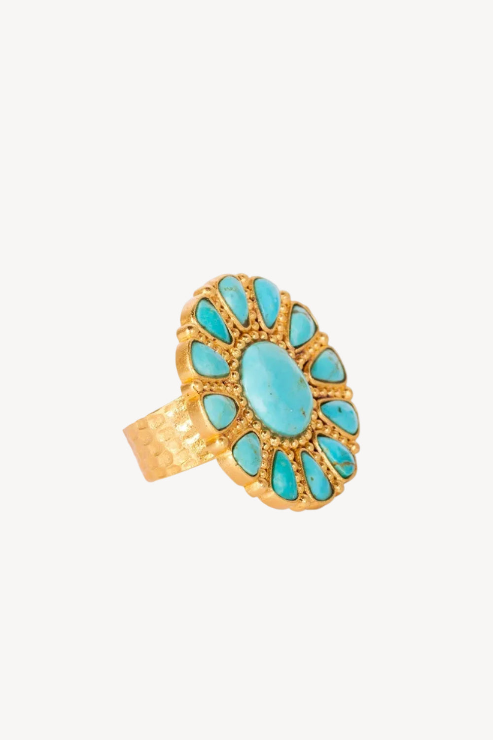 Gold ring with turquoise stones on a white background