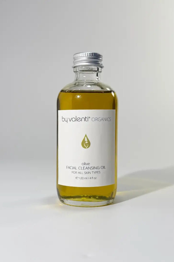 Bottle of olive facial cleansing oil by valenti on a gray background