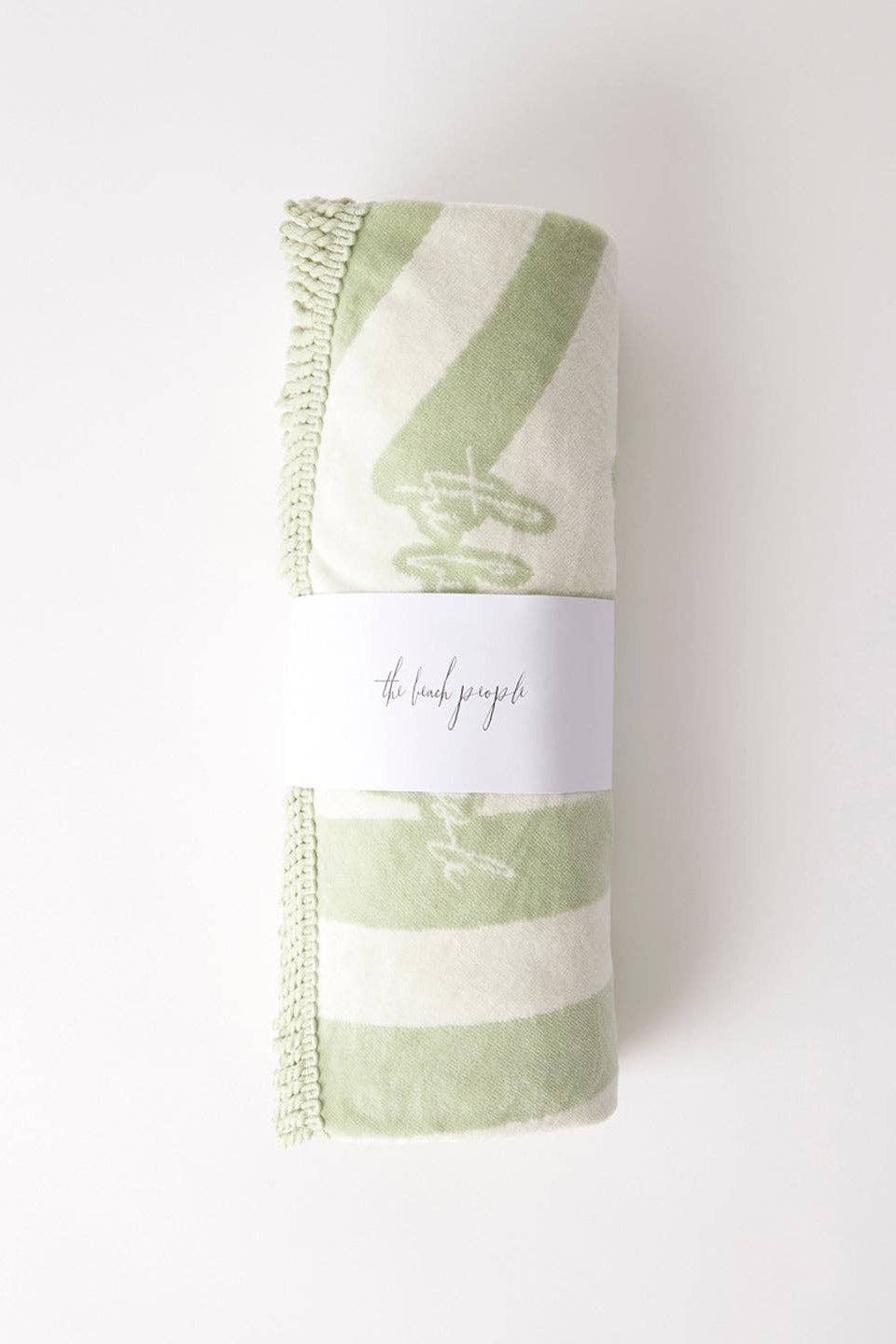 Green and white striped towel with a label on a white background