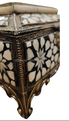 Decorative box with intricate design on a white background