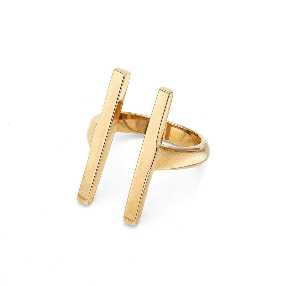 Gold ring with a modern design on a white background