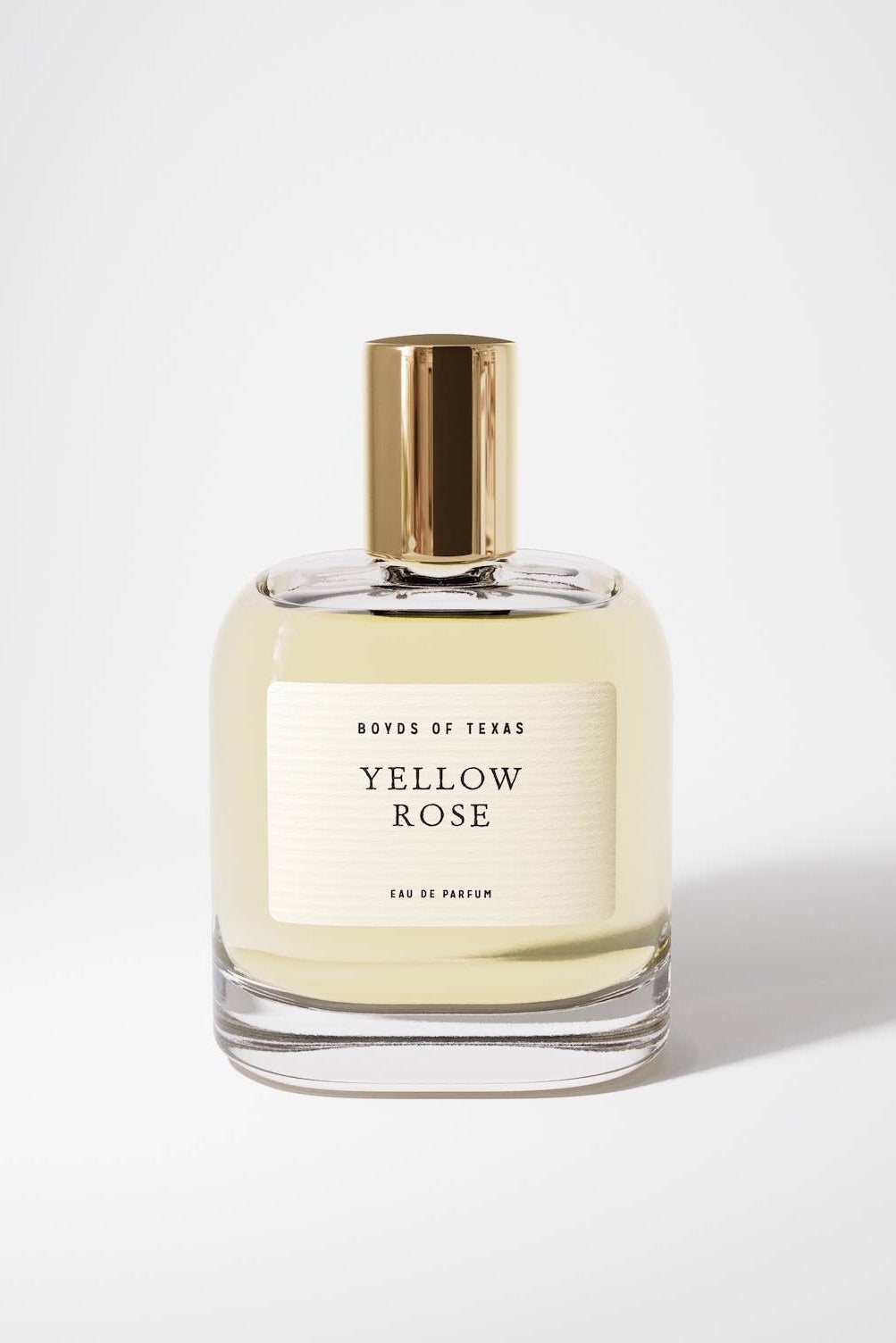 Perfume bottle labeled 'Yellow Rose' by 'Boyos of Texas' on a white background