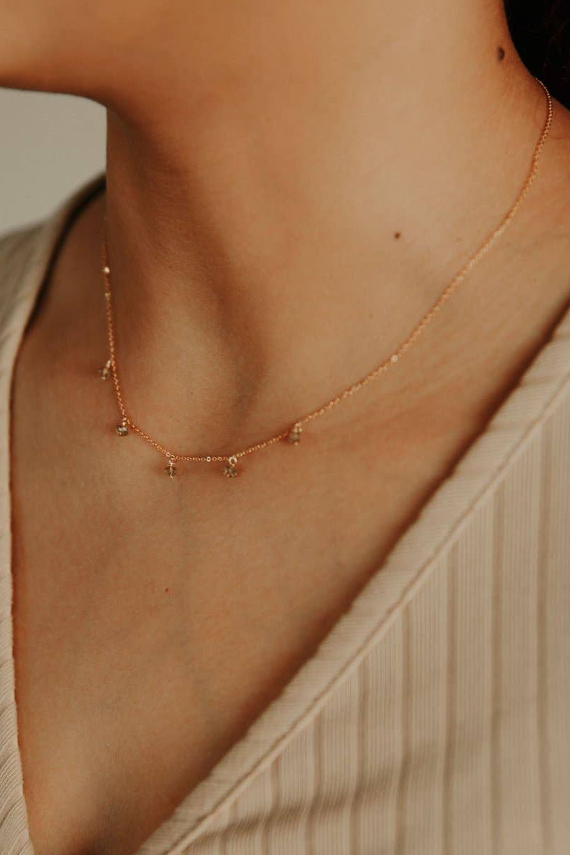 Small labradorite necklace on a woman's neckline.