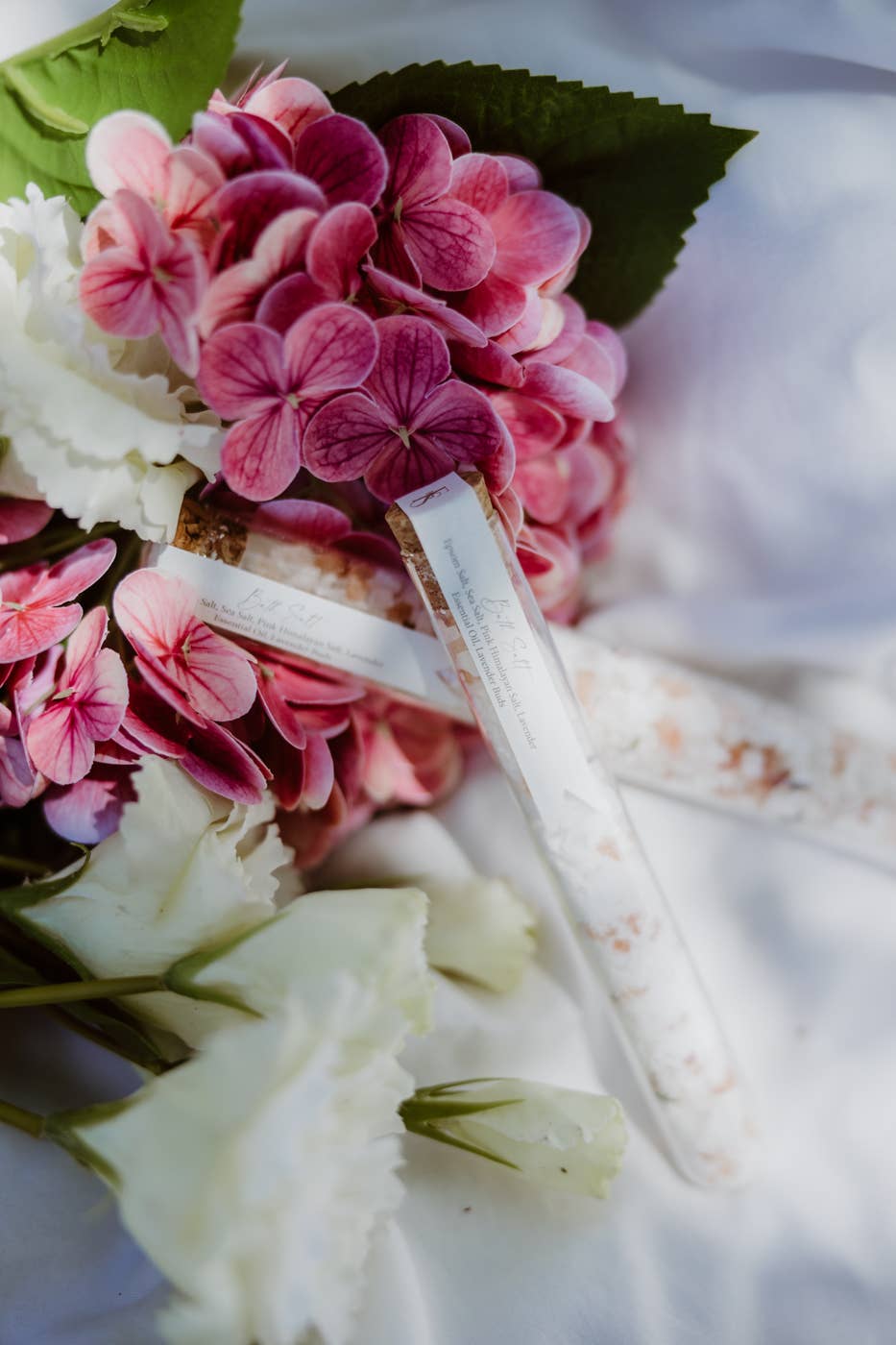 Close-up of a bouquet with pink and white flowers on a light background