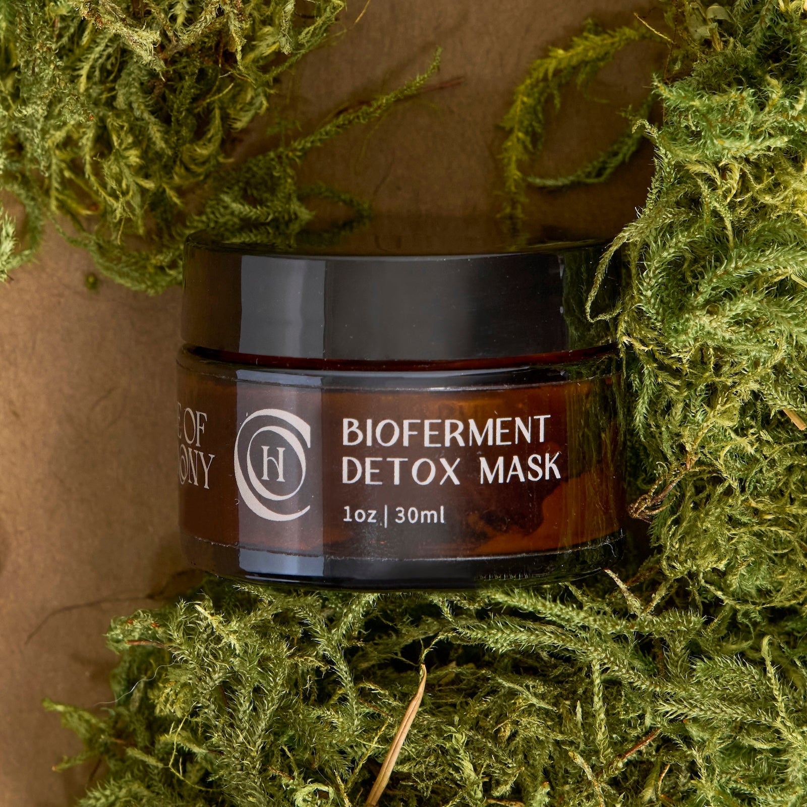 Jar of Bioferment Detox Mask on a moss background