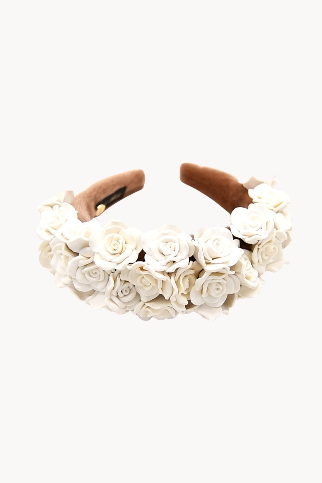Floral headband with white flowers and brown ribbons on a white background