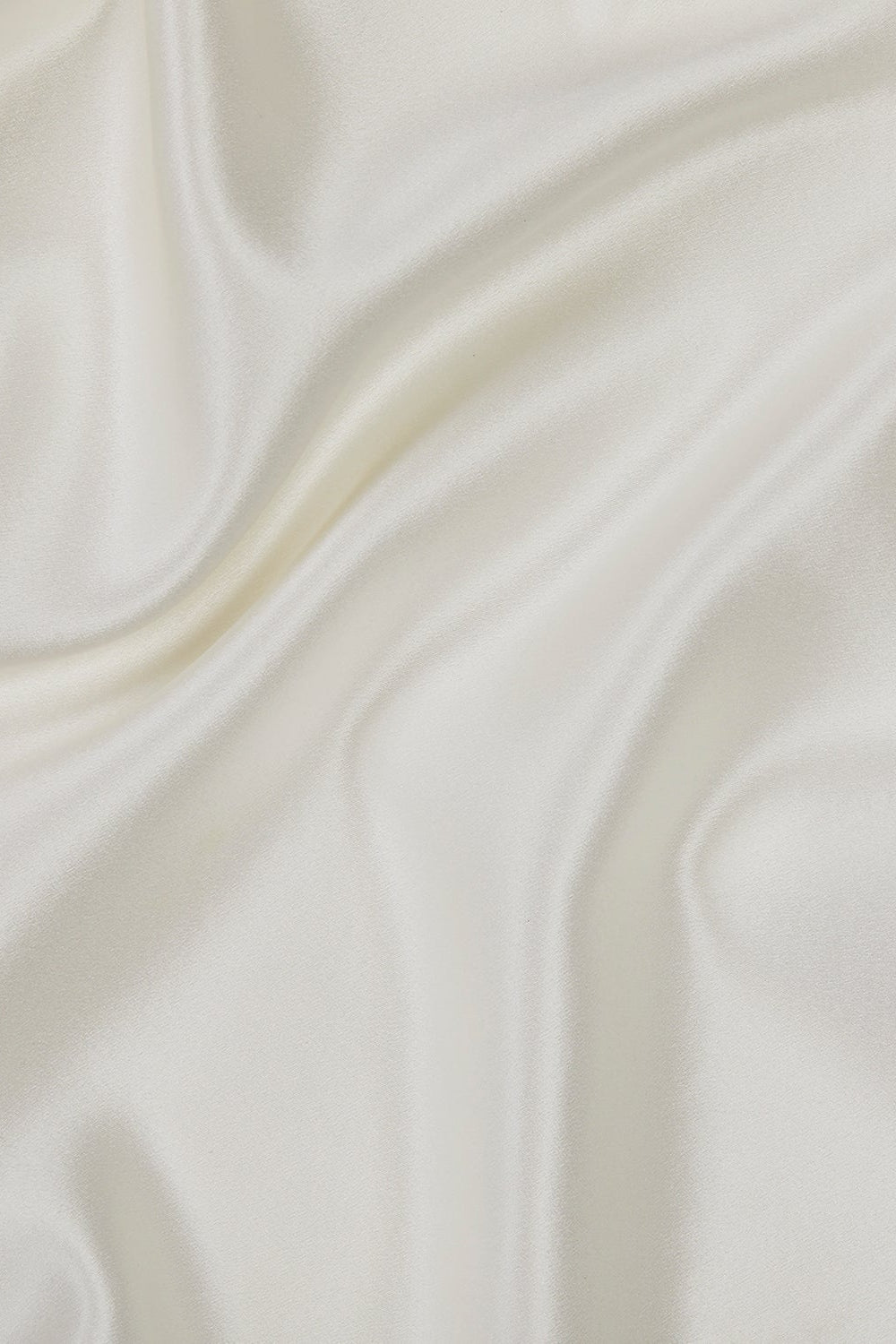 Close-up of smooth, white fabric with subtle texture