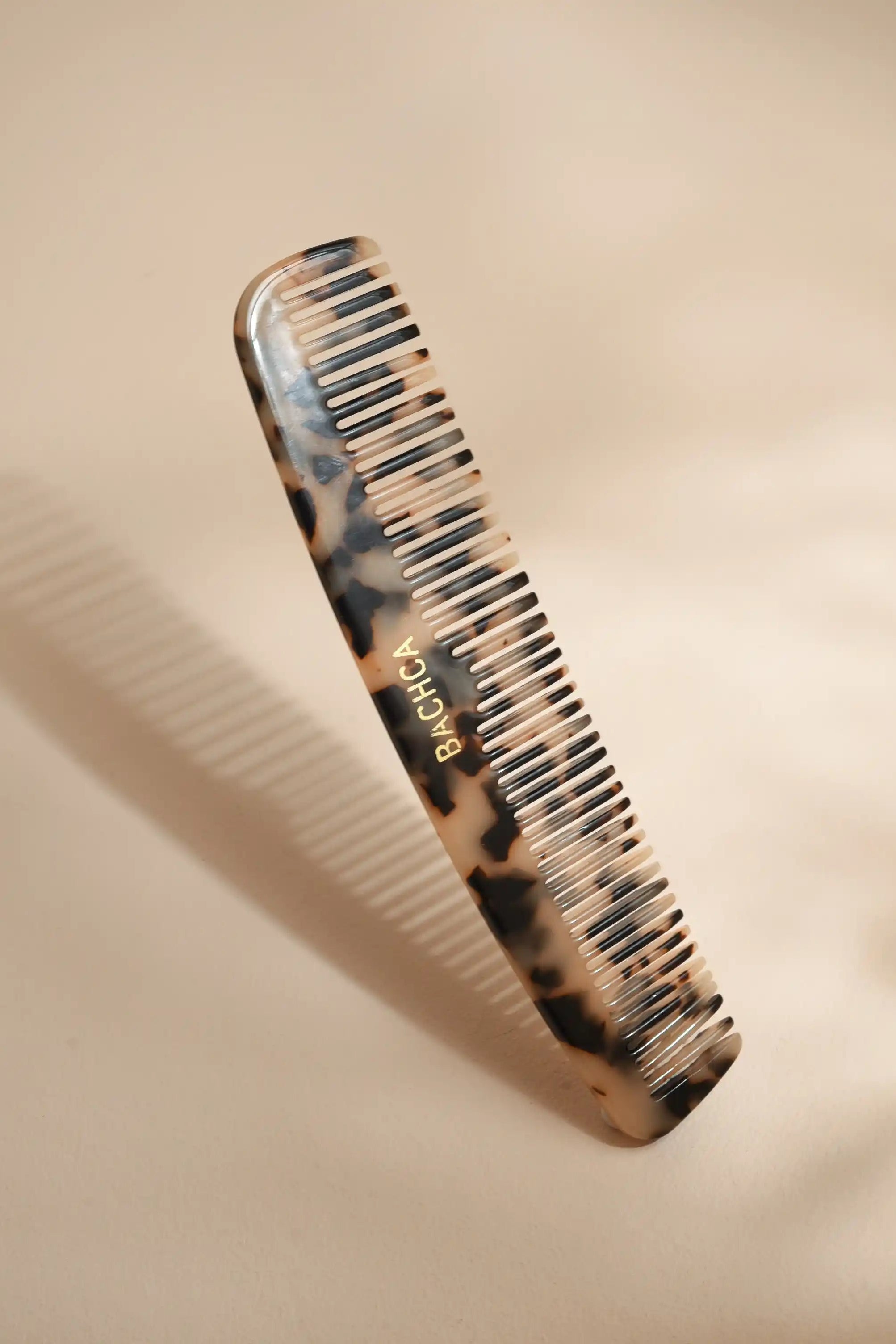 Tortoiseshell comb on a beige background