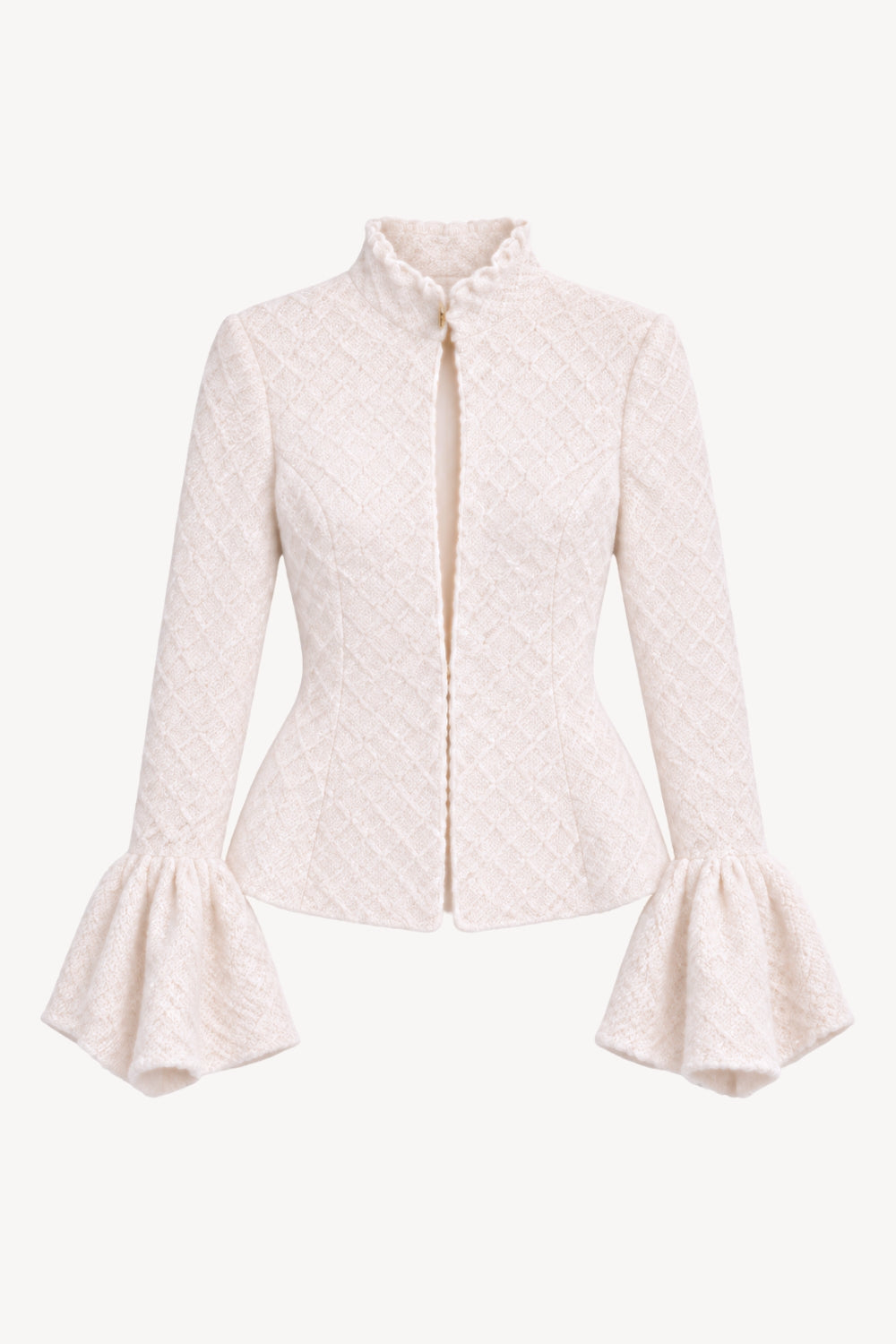 A cream colored, peplum, knitted blazer with bell sleeves.