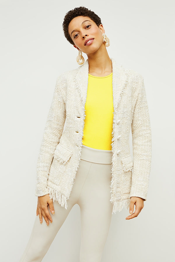 Front image of a woman standing wearing the porter jacket in taupe and ivory | Exclude