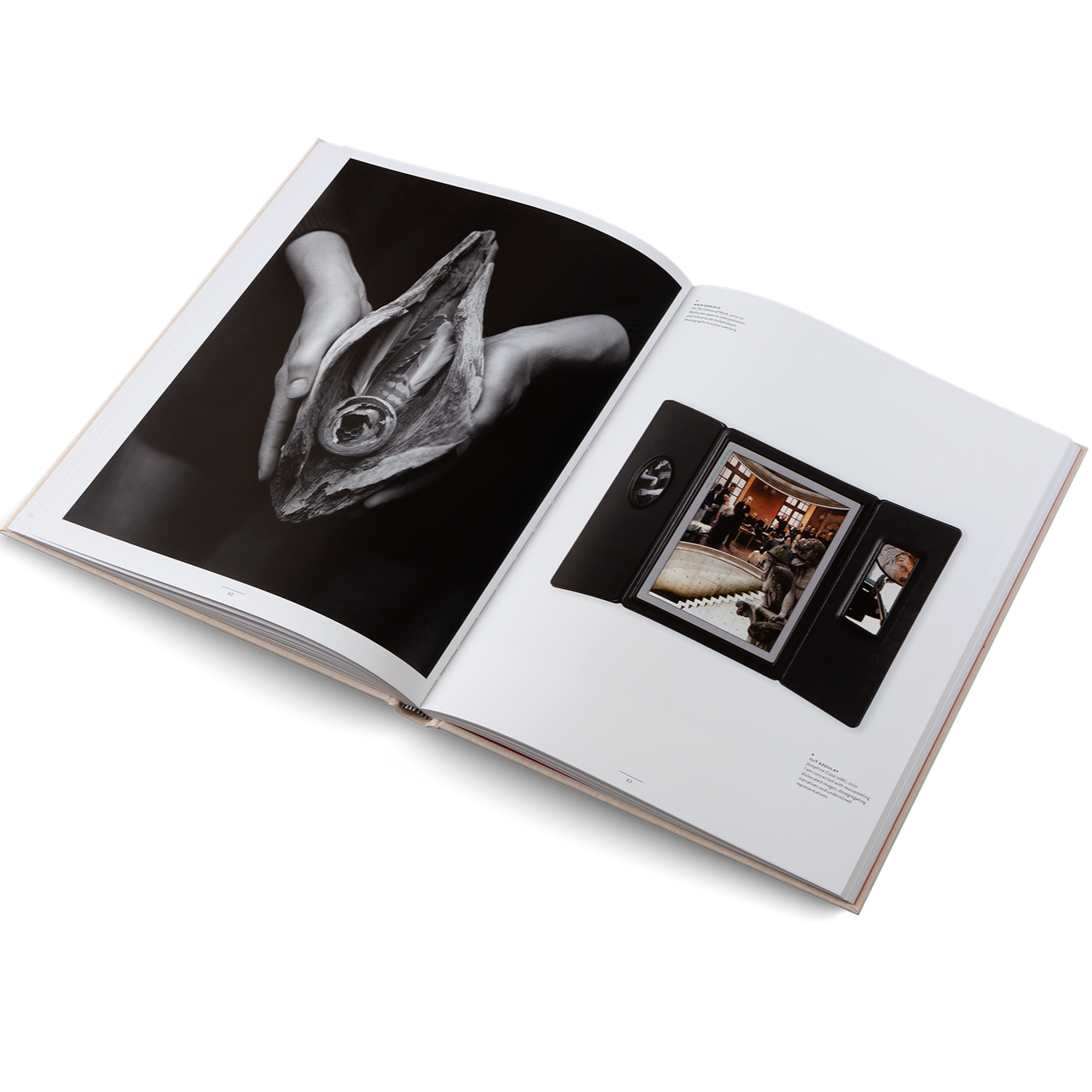 Open book displaying a black and white photograph of an animal's face and a smaller inset photo on a white background.