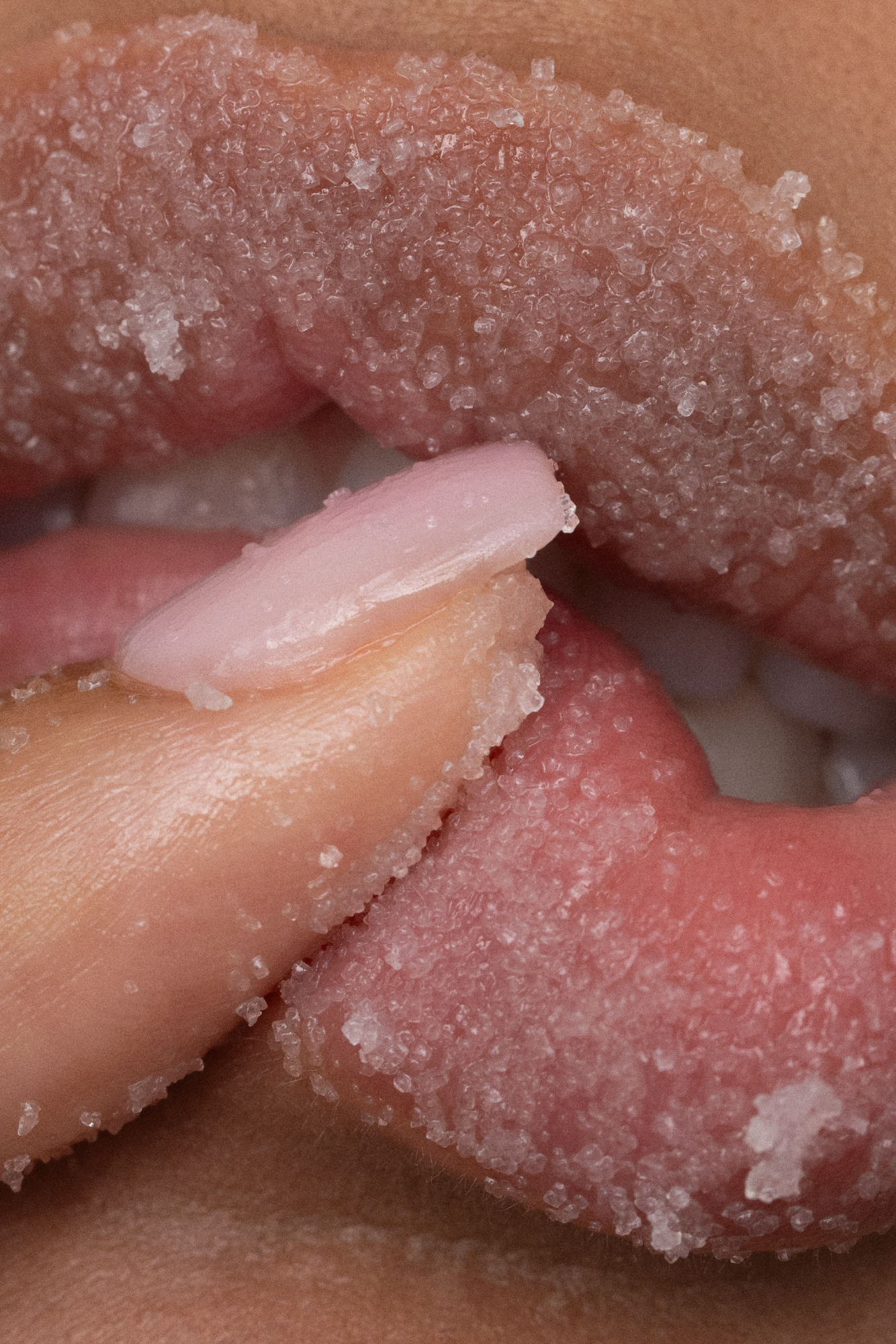 Close-up of a hand with sugar crystals on the skin