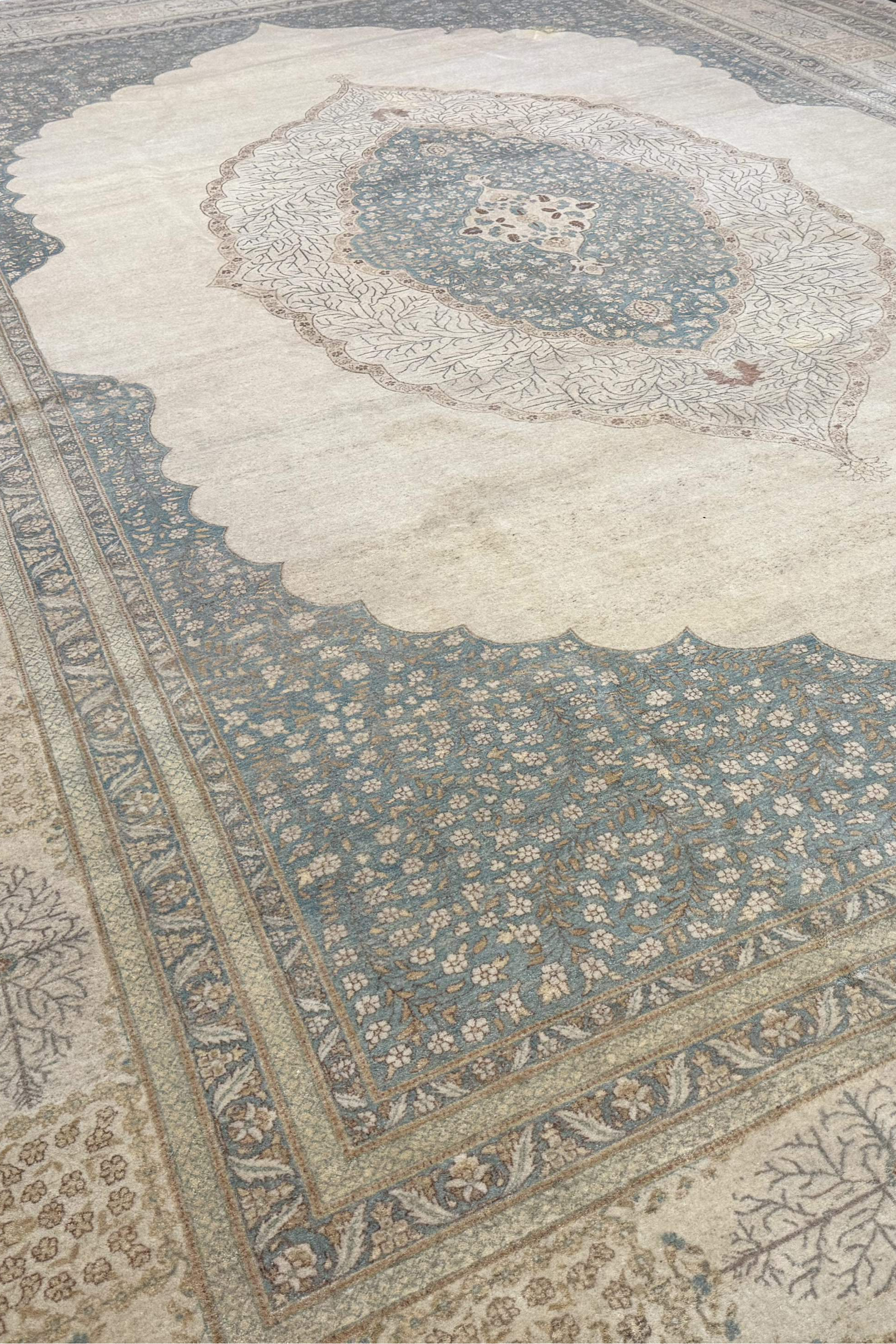 Large ornate rug with intricate patterns on a plain background