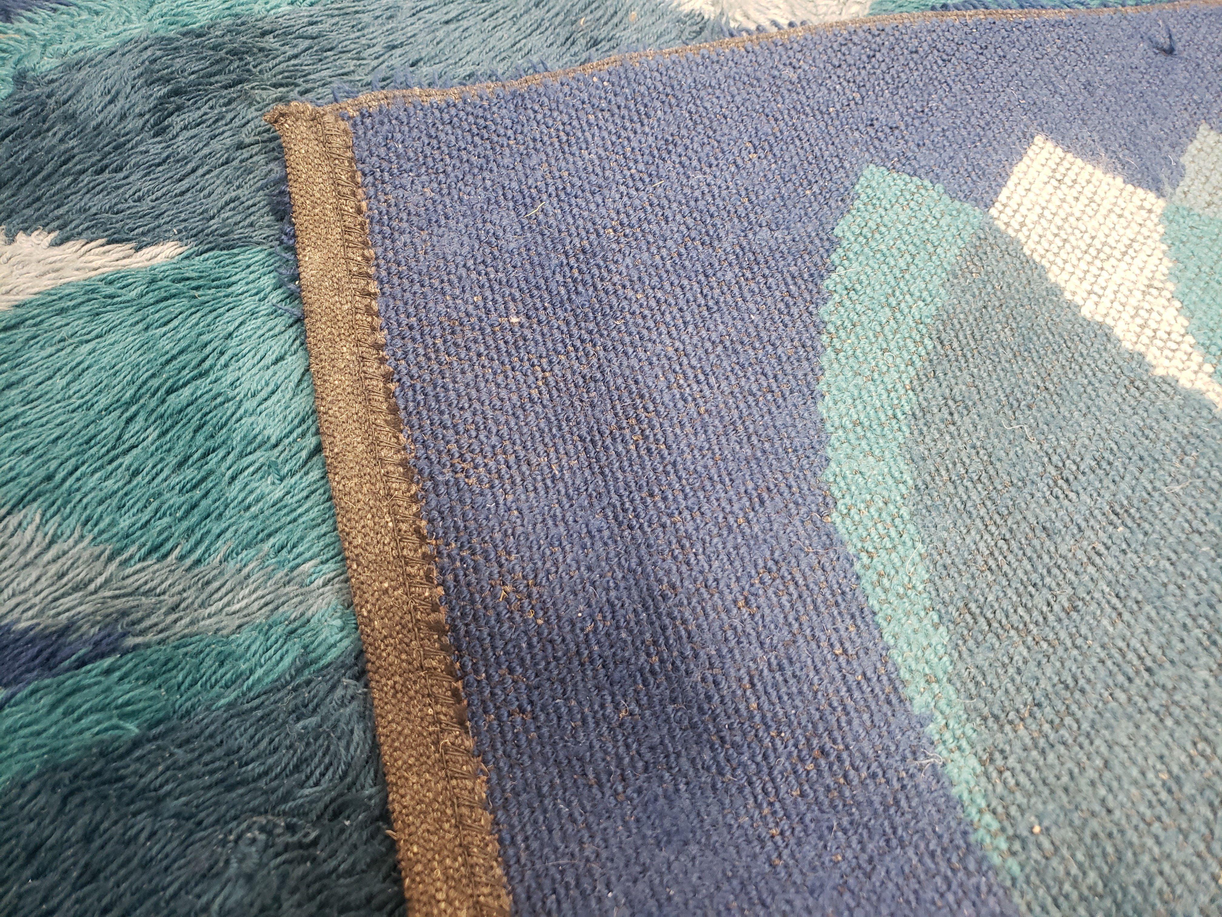 Close-up of the back of a textured rug with geometric pattern