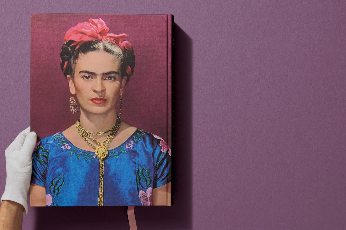 Framed portrait of a woman with a pink headband on a purple background