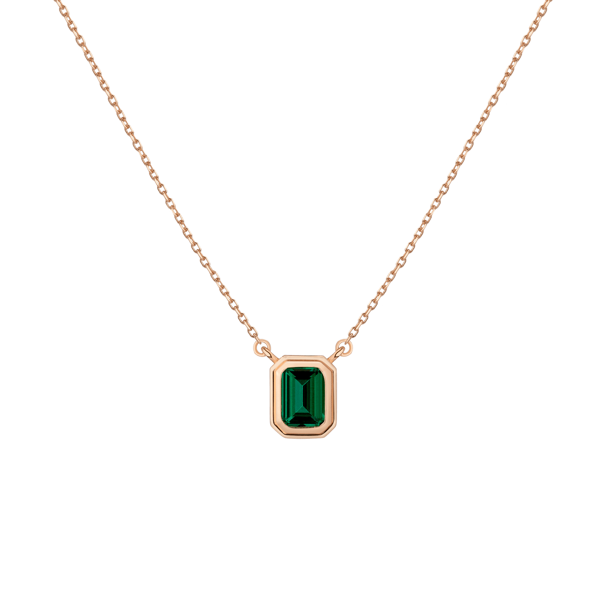 Rose gold necklace with a green gemstone pendant on a transparent background