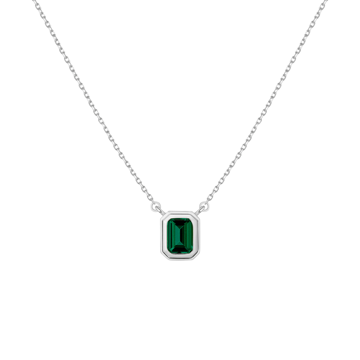 Silver necklace with a green gemstone pendant on a transparent background
