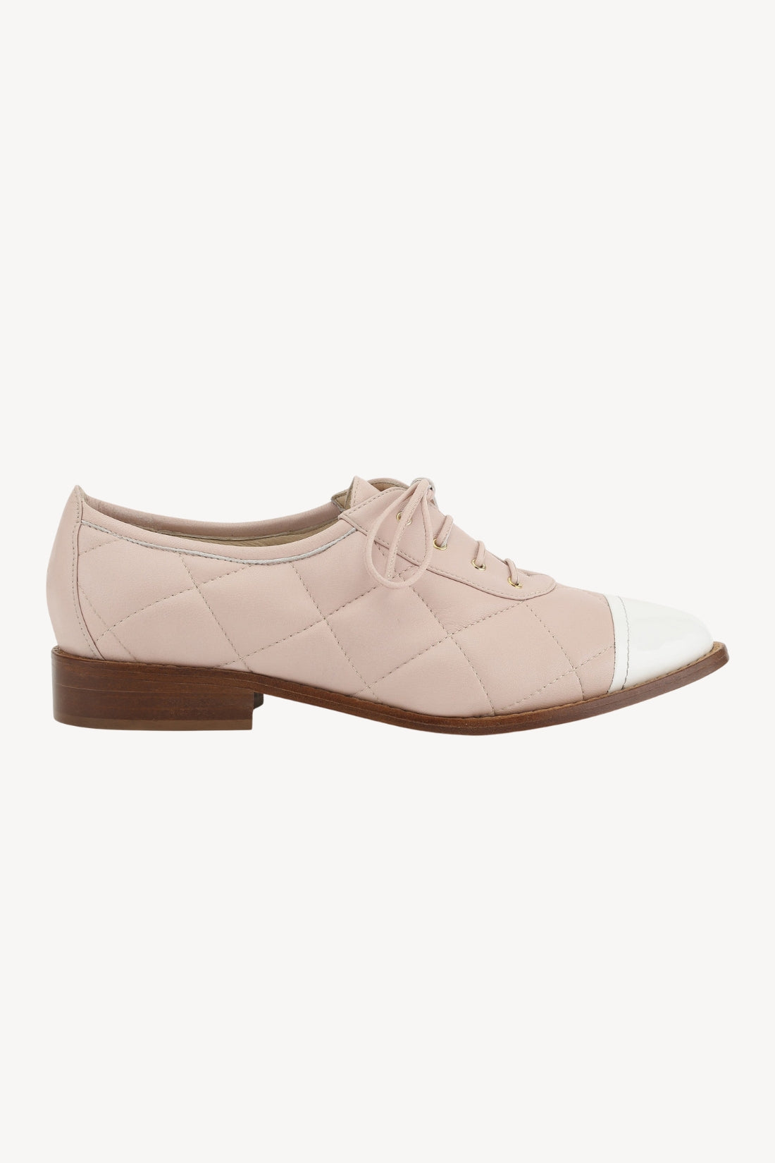 Beige and white shoe on a white background
