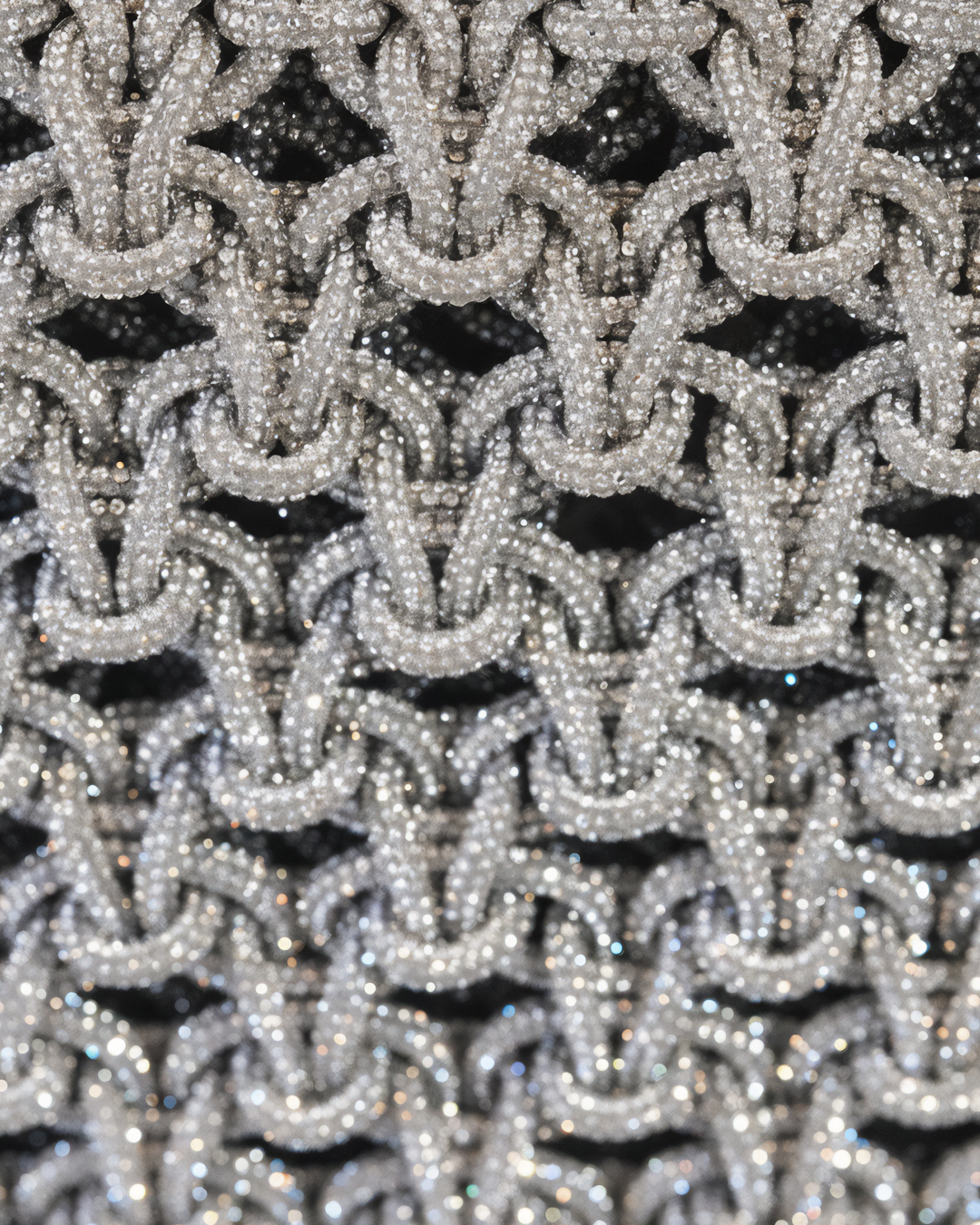 Close-up of a silver beaded pattern