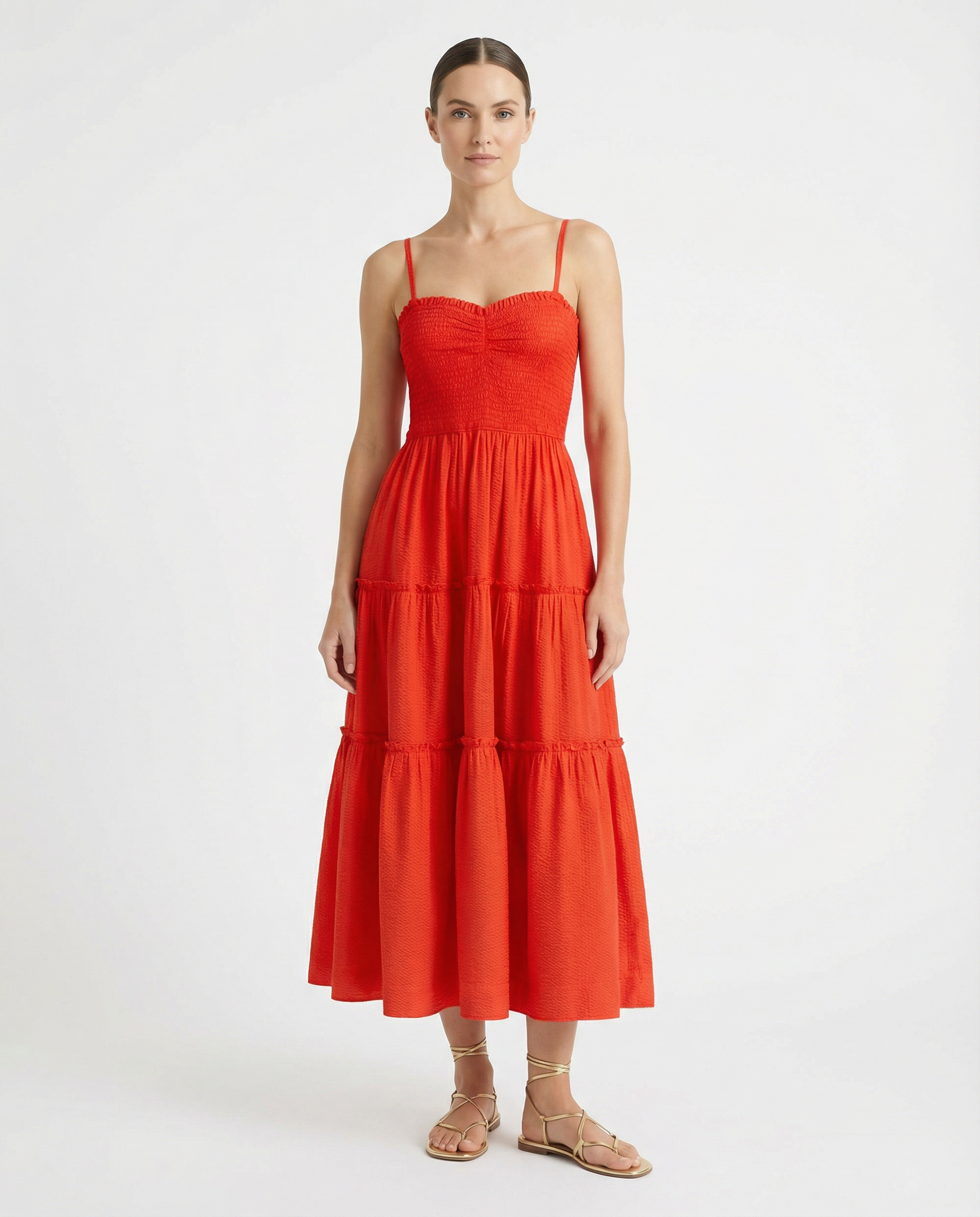 Woman wearing a red dress on a white background