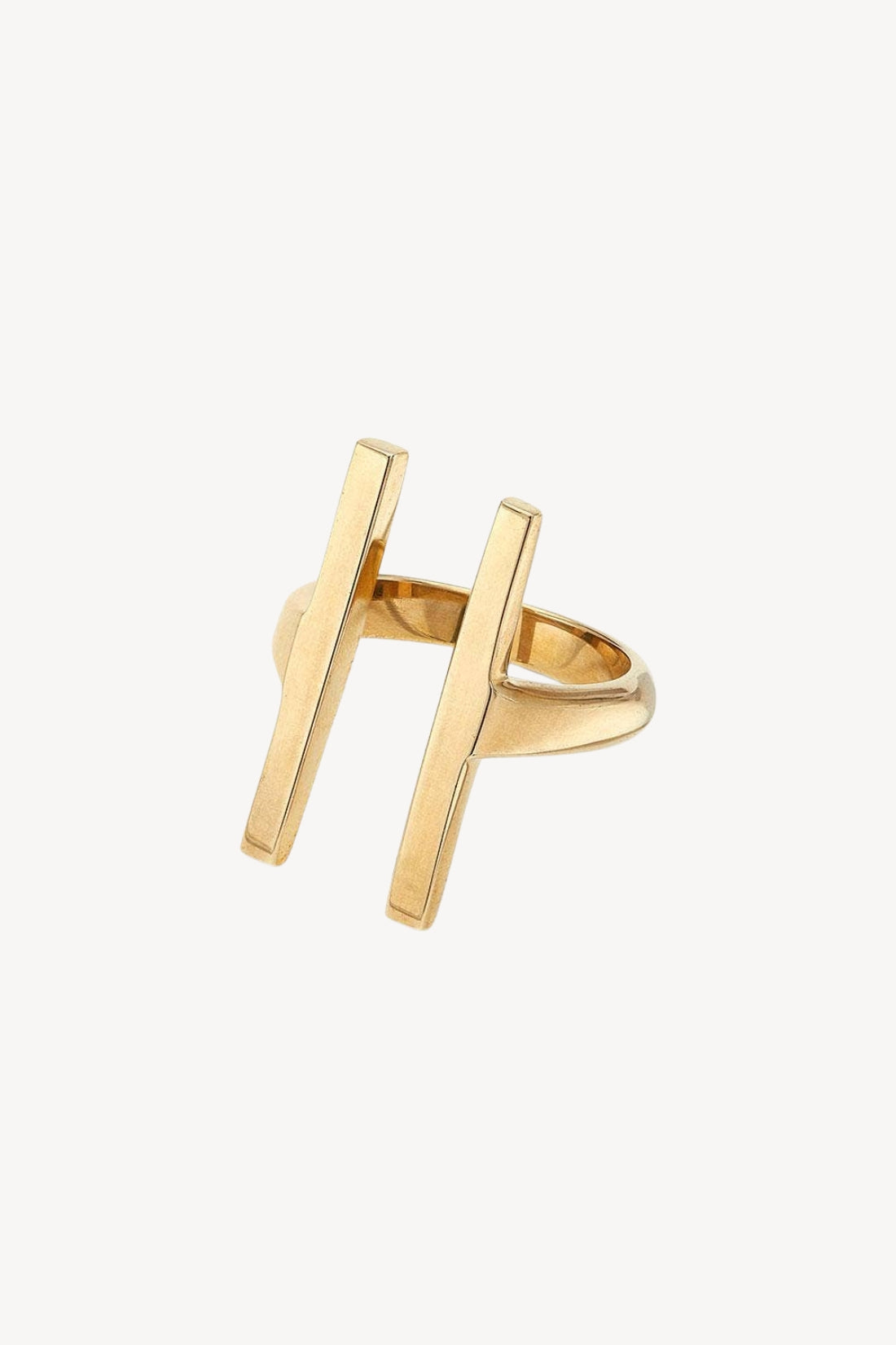 Gold ring with two vertical bars on a white background